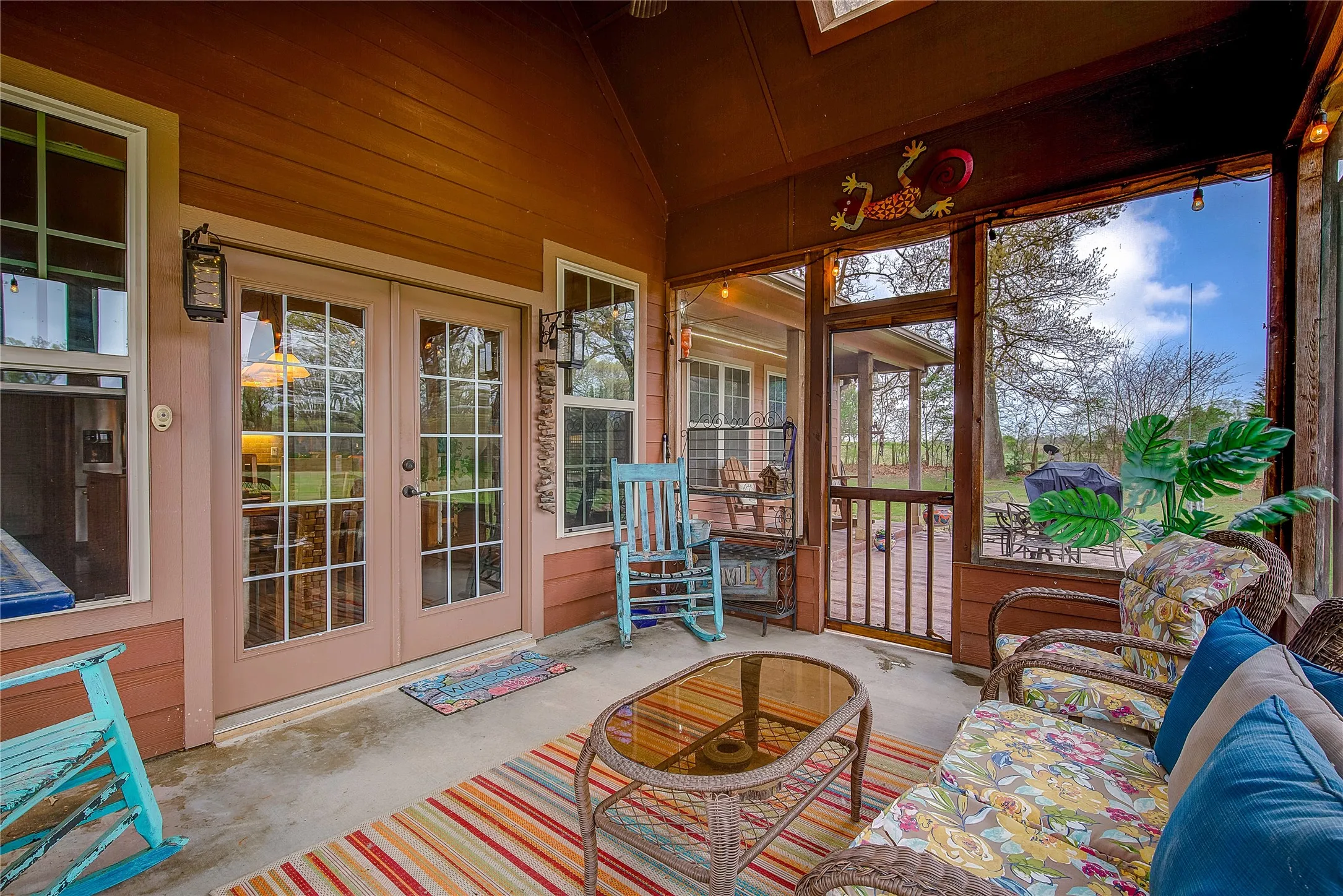 Large screened-in back porch measuring 14’1” x 11’7”, perfect for relaxing and enjoying the outdoors.