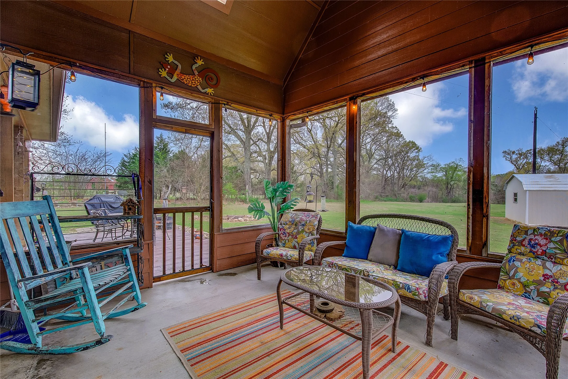 Large screened-in back porch measuring 14’1” x 11’7”, perfect for relaxing and enjoying the outdoors.