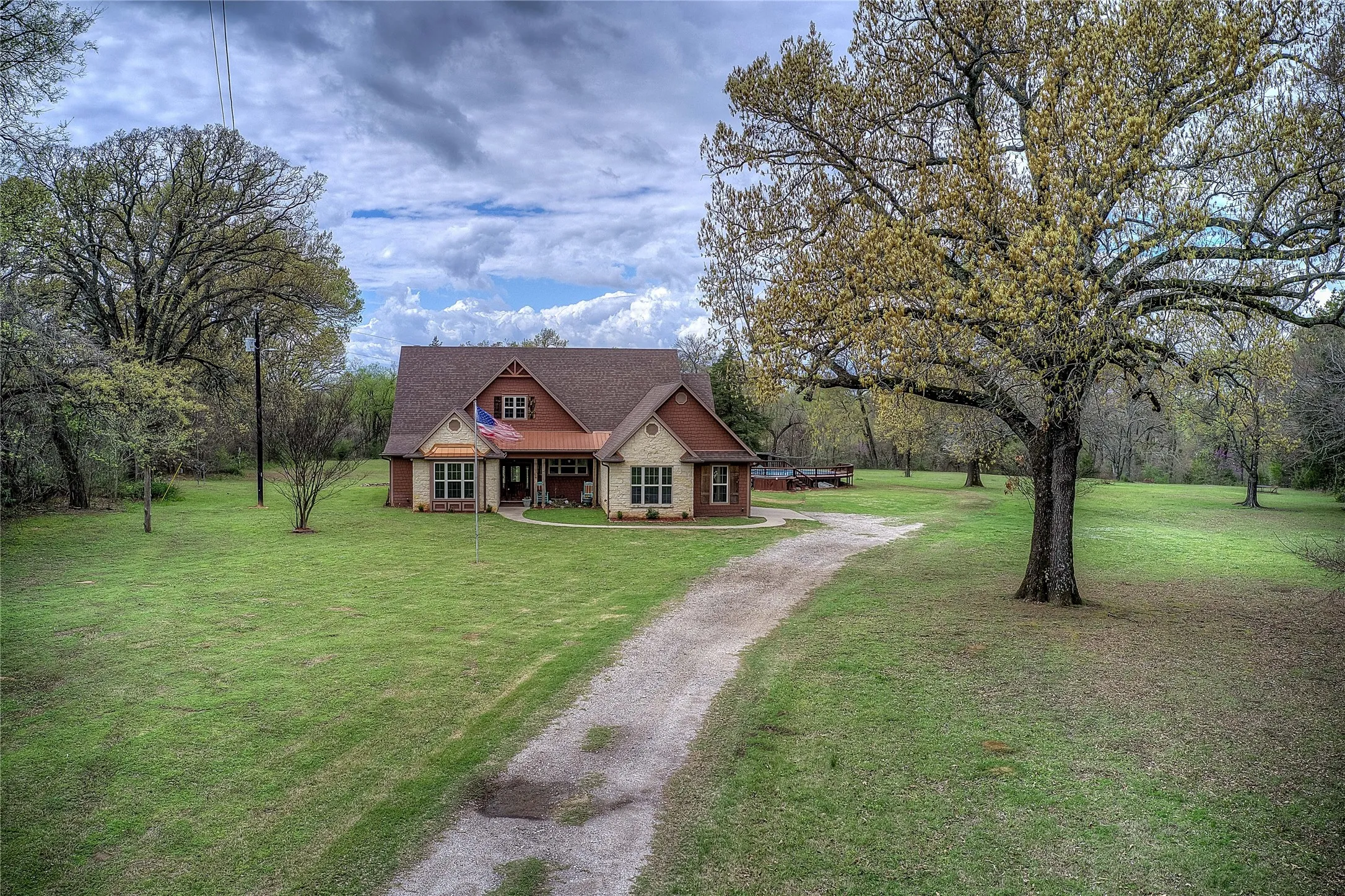 Private country retreat with multiple storage sheds, an above-ground pool with new decking, hot tub, and a private RV hookup with its own septic and electric meter.