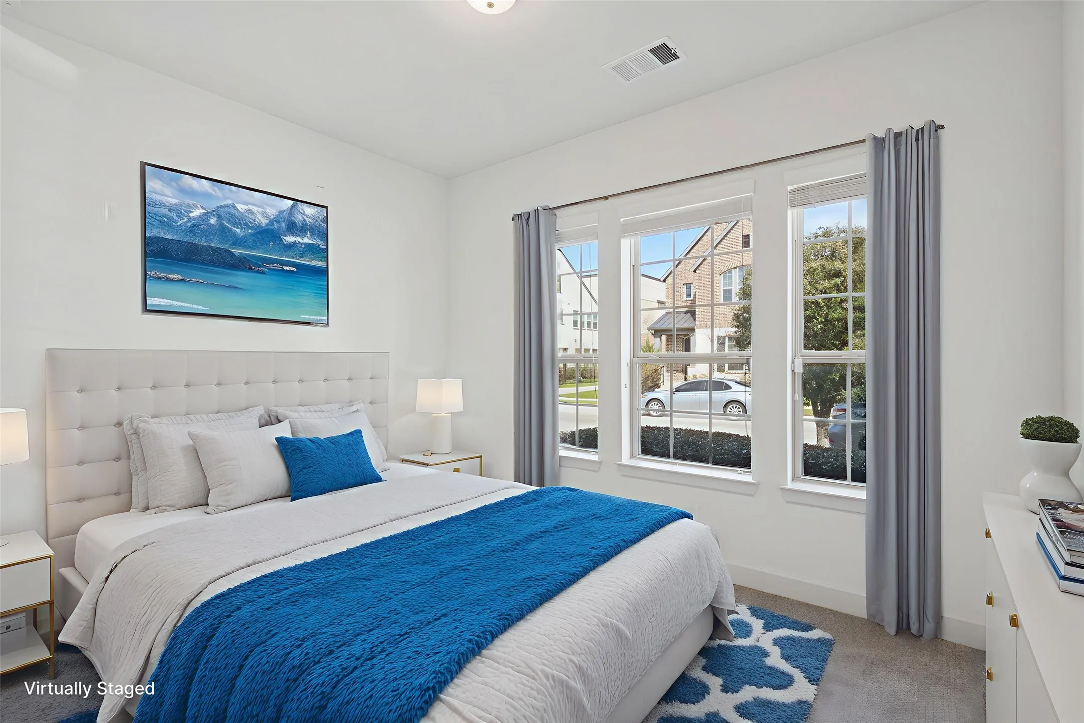 First floor bedroom with light carpet and baseboards