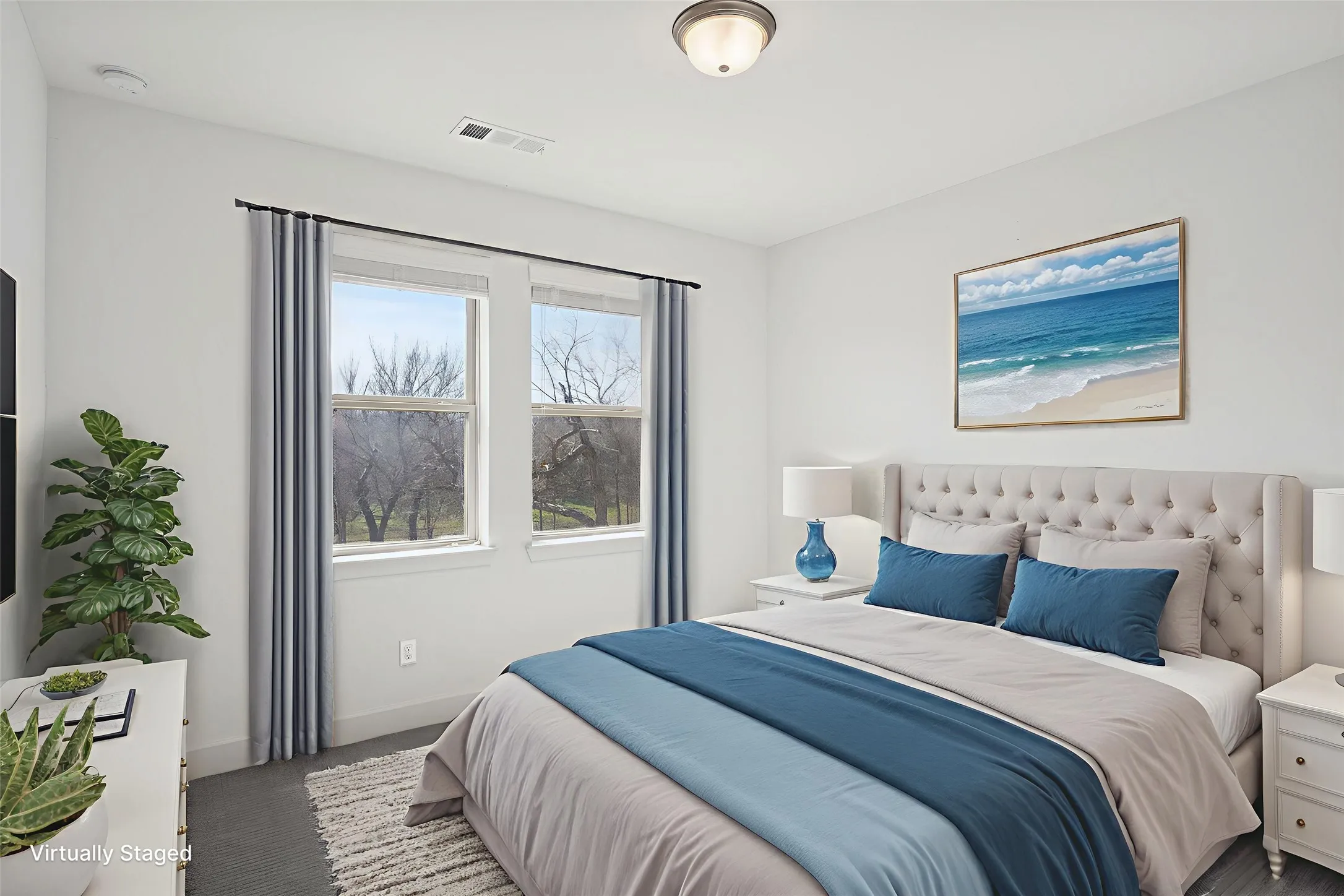 2nd floor bedroom with baseboards and dark colored carpet