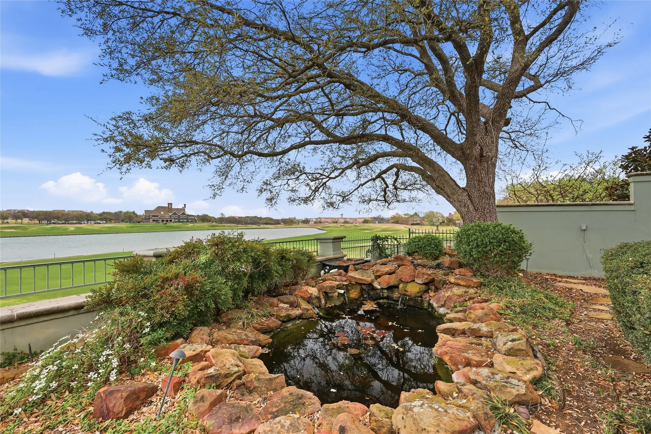 View of yard featuring a small pond