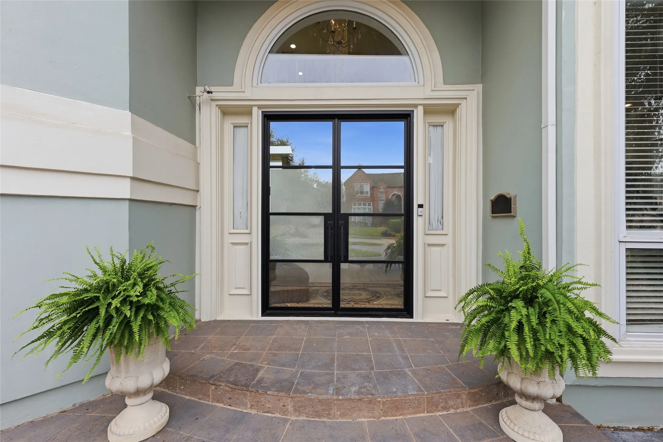 Entrance to property with a patio