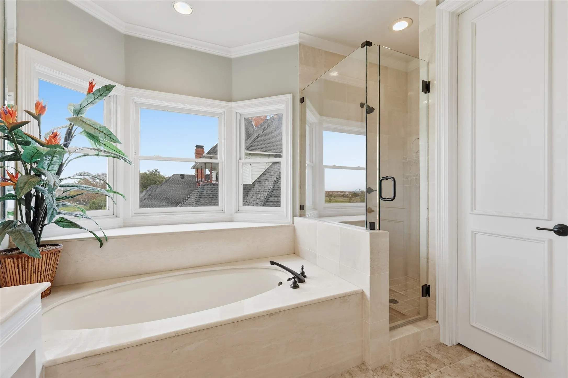 Full bathroom with a shower stall, a bath, crown molding, and recessed lighting