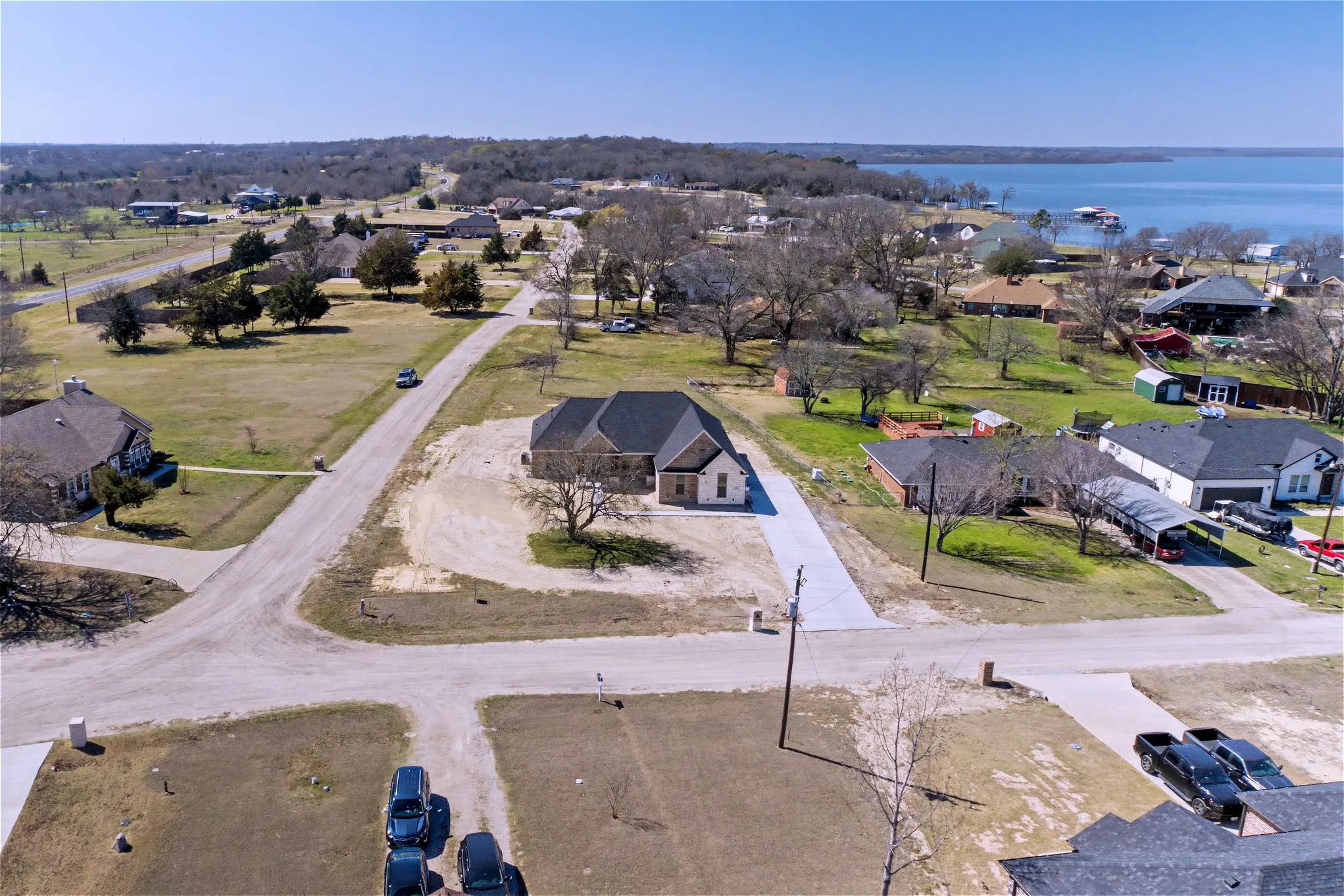 Aerial perspective of suburban area with a large body of water