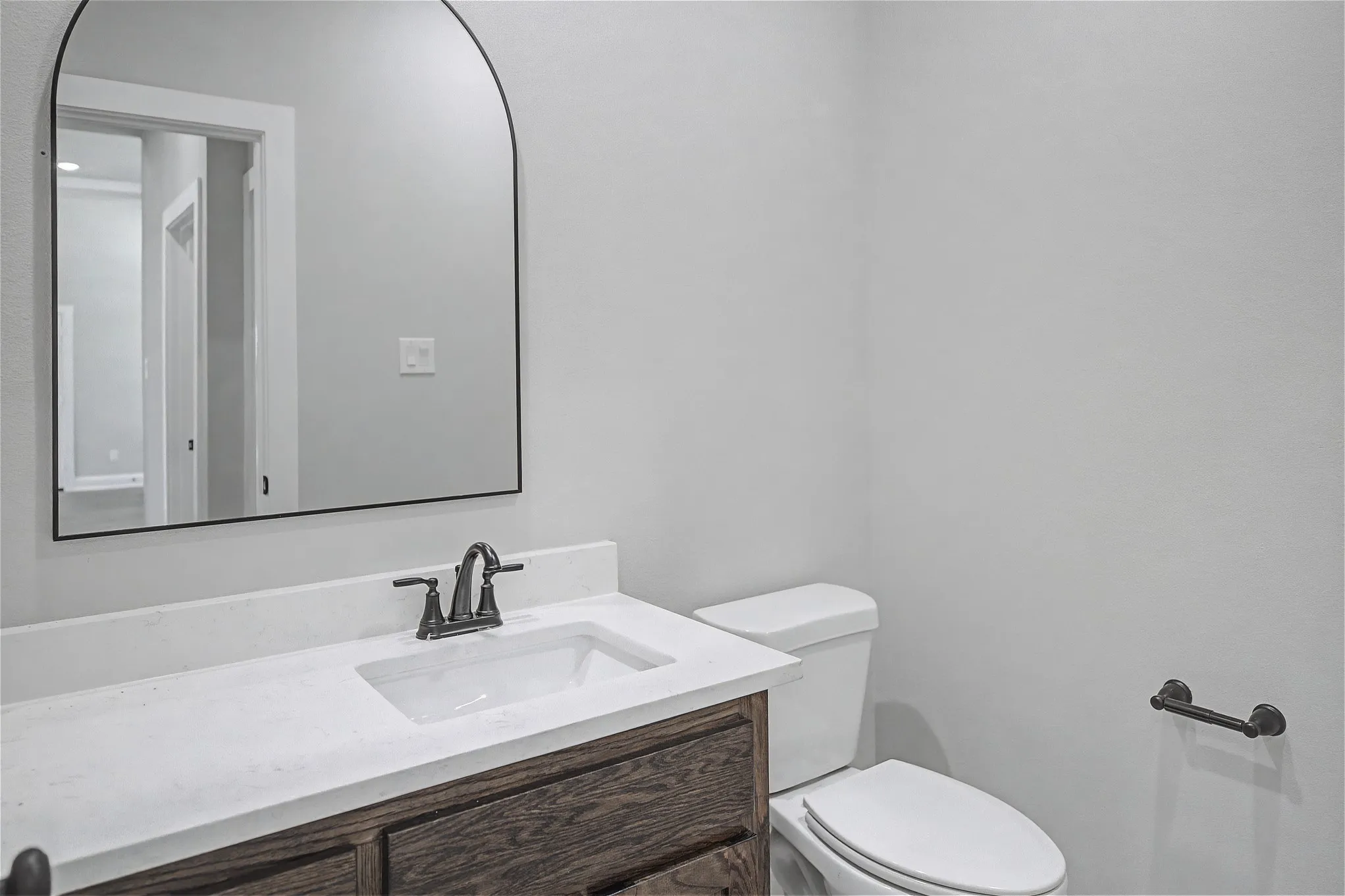 Half bath with vanity and toilet
