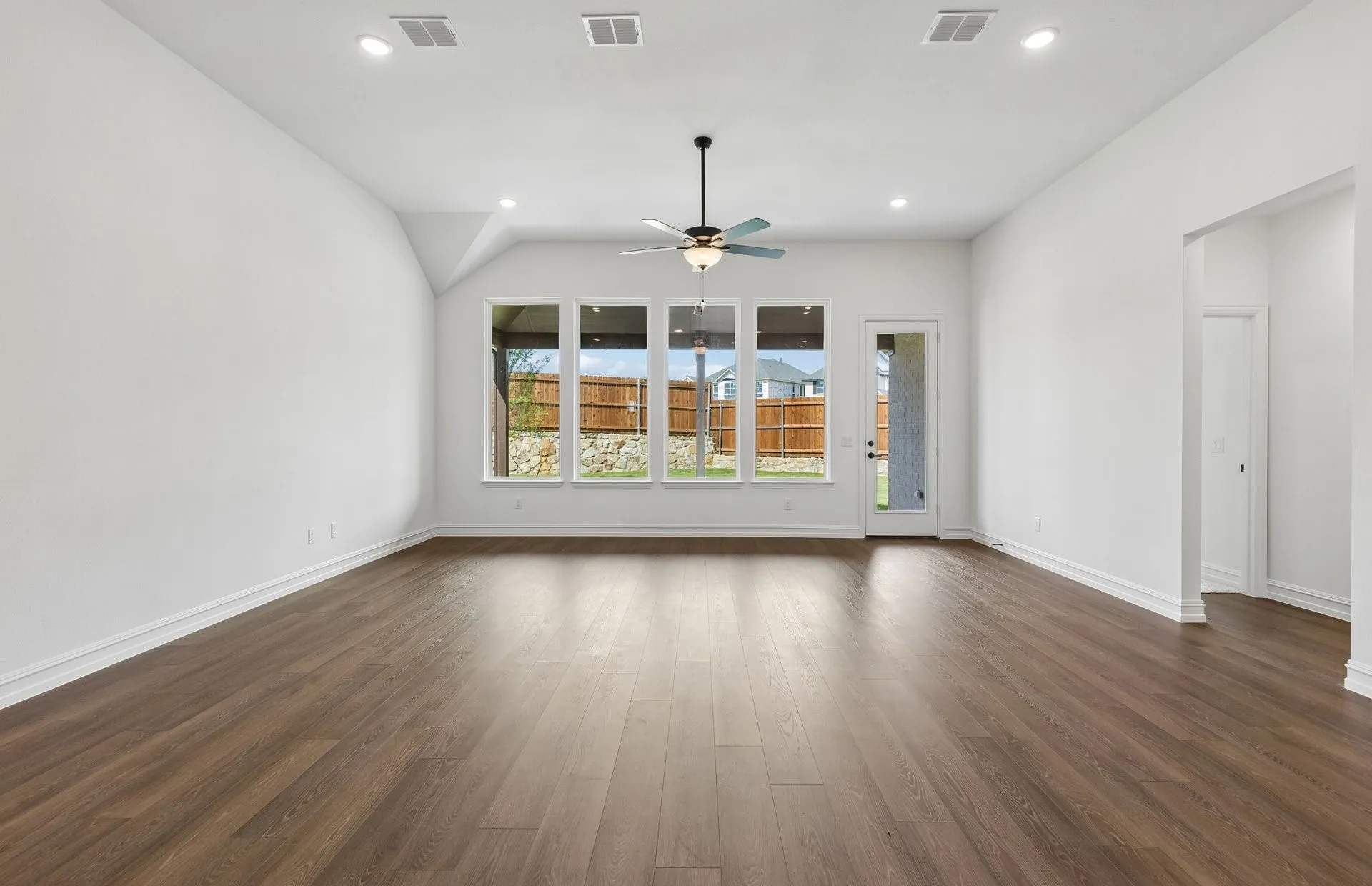 Gathering room with large windows and natural light