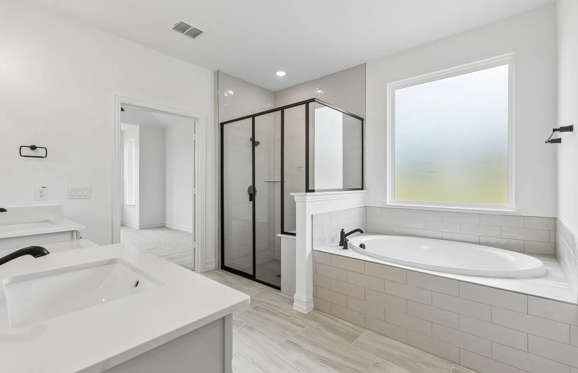 Owners bath with separate tub and shower