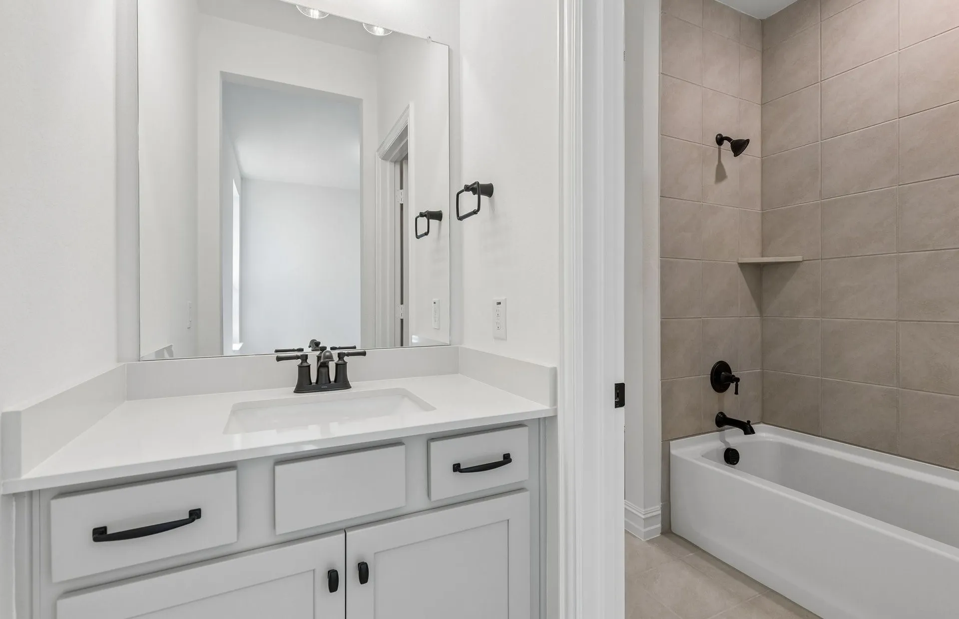 Secondary bath with tile surrounded shower