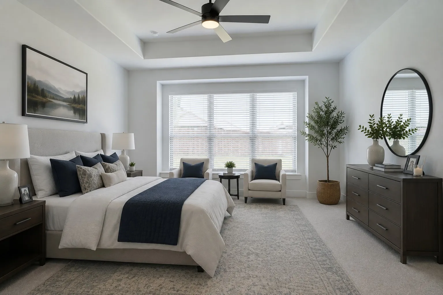 Virtually staged. Spacious room featuring a tray ceiling with a ceiling fan, plush carpeting, and a large window with blinds