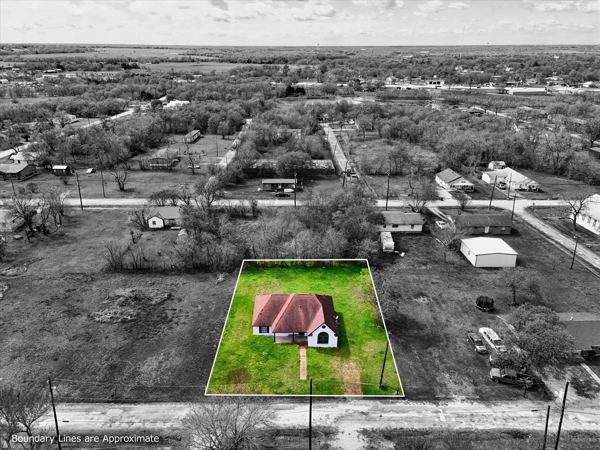Aerial view of property and surrounding area featuring property parcel outlined