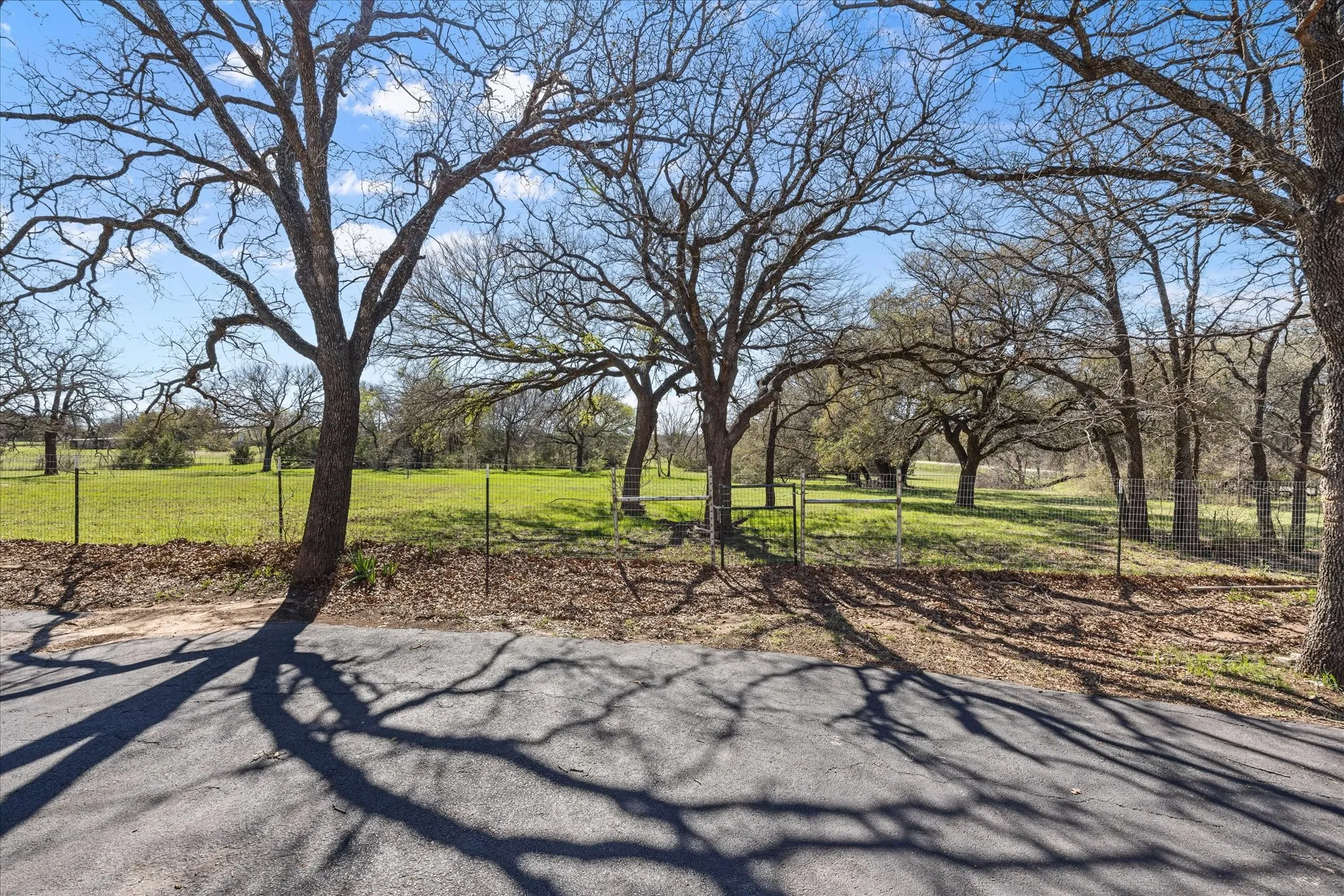 This shows all the driveway is paved up to the house and into the garage.  The property also has an electric gate.