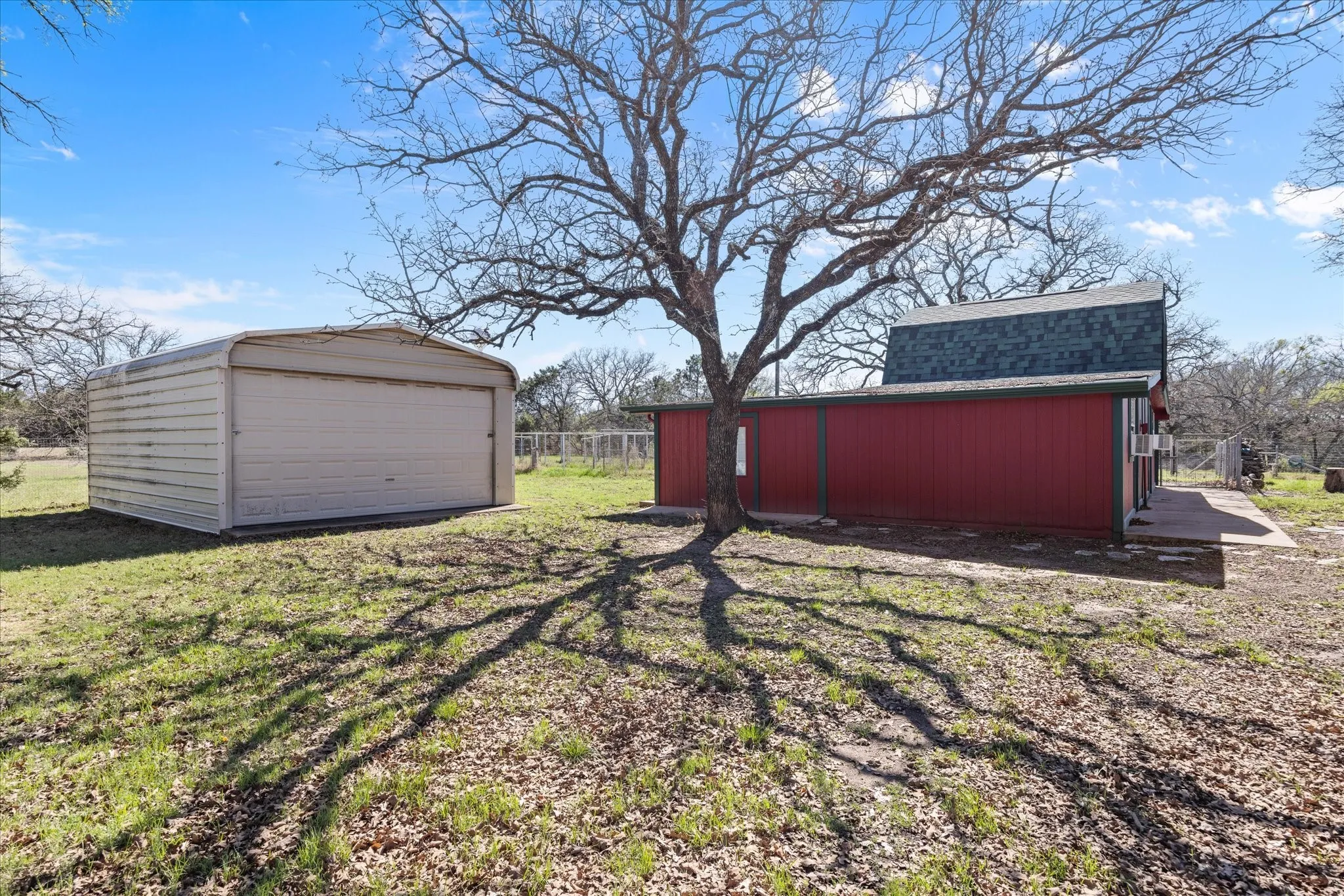 This shows the building for a workshop plus all the red building with fresh paint is used now as a dog facility