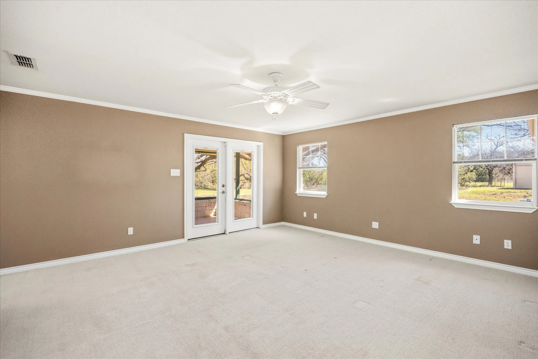 This is a very large Primary Bedroom it has a screened in porch out those double doors that overlook the tennis courts.