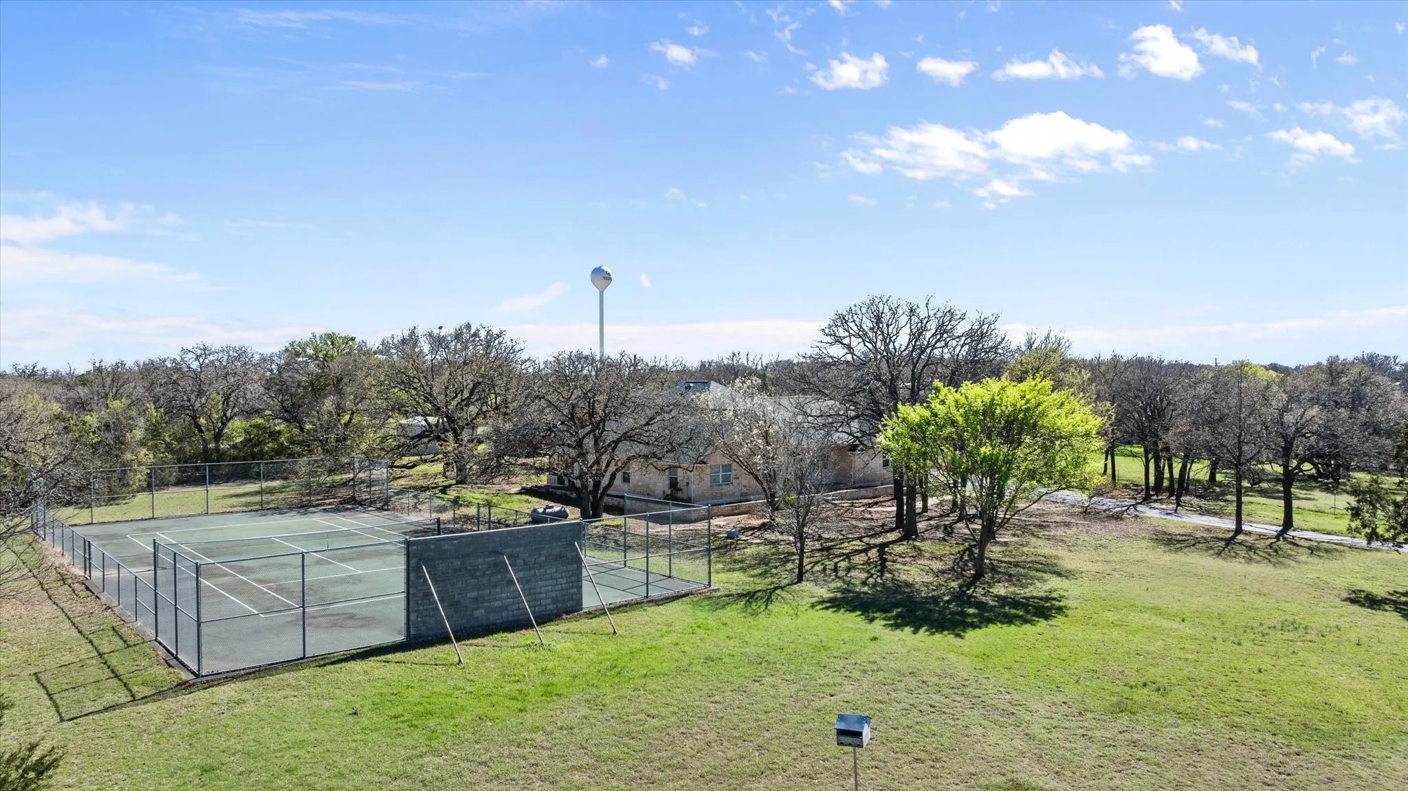 This Tennis court would also make a great pickle ball court.  Very easy to add the lines.