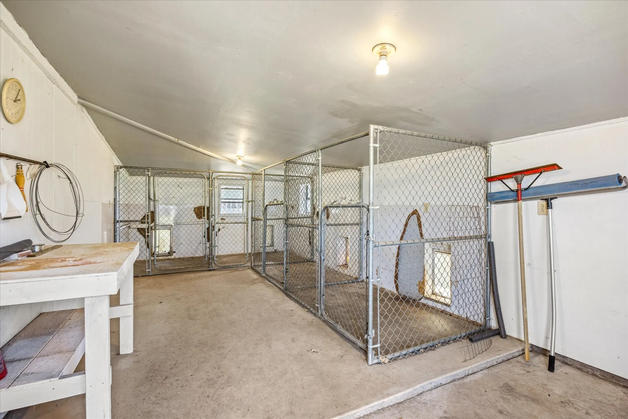 This room is where the dogs stay each kennel has its own doggy door and air-conditioning from a window unit.