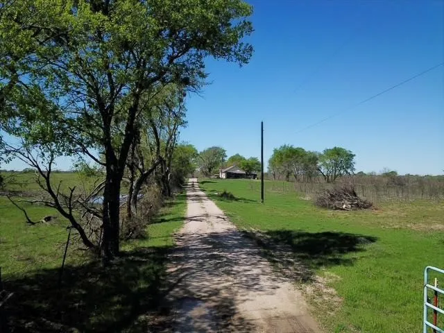 View of dirt / gravel road featuring a view of countryside