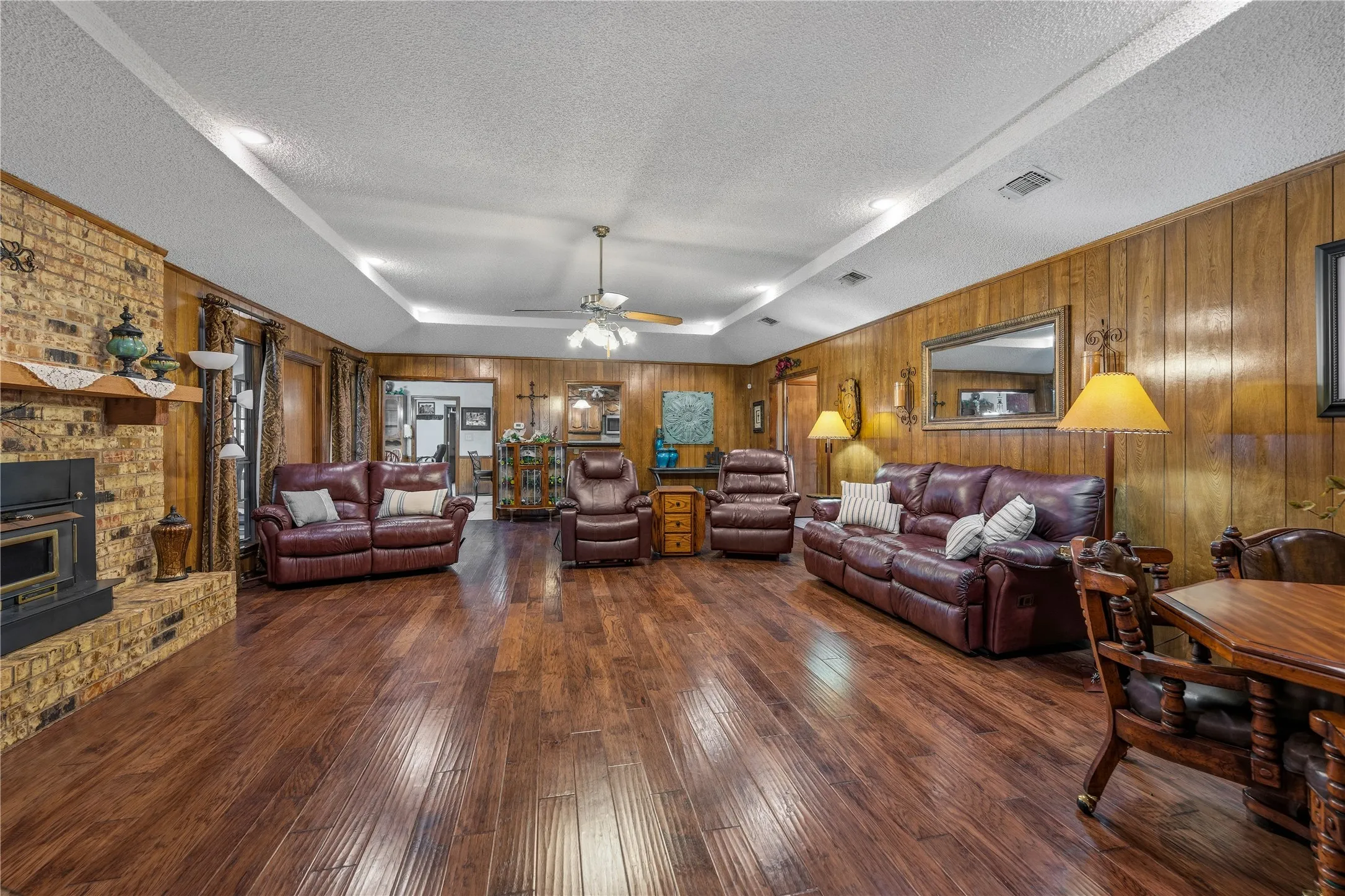 Large living room with ample seating and natural light.