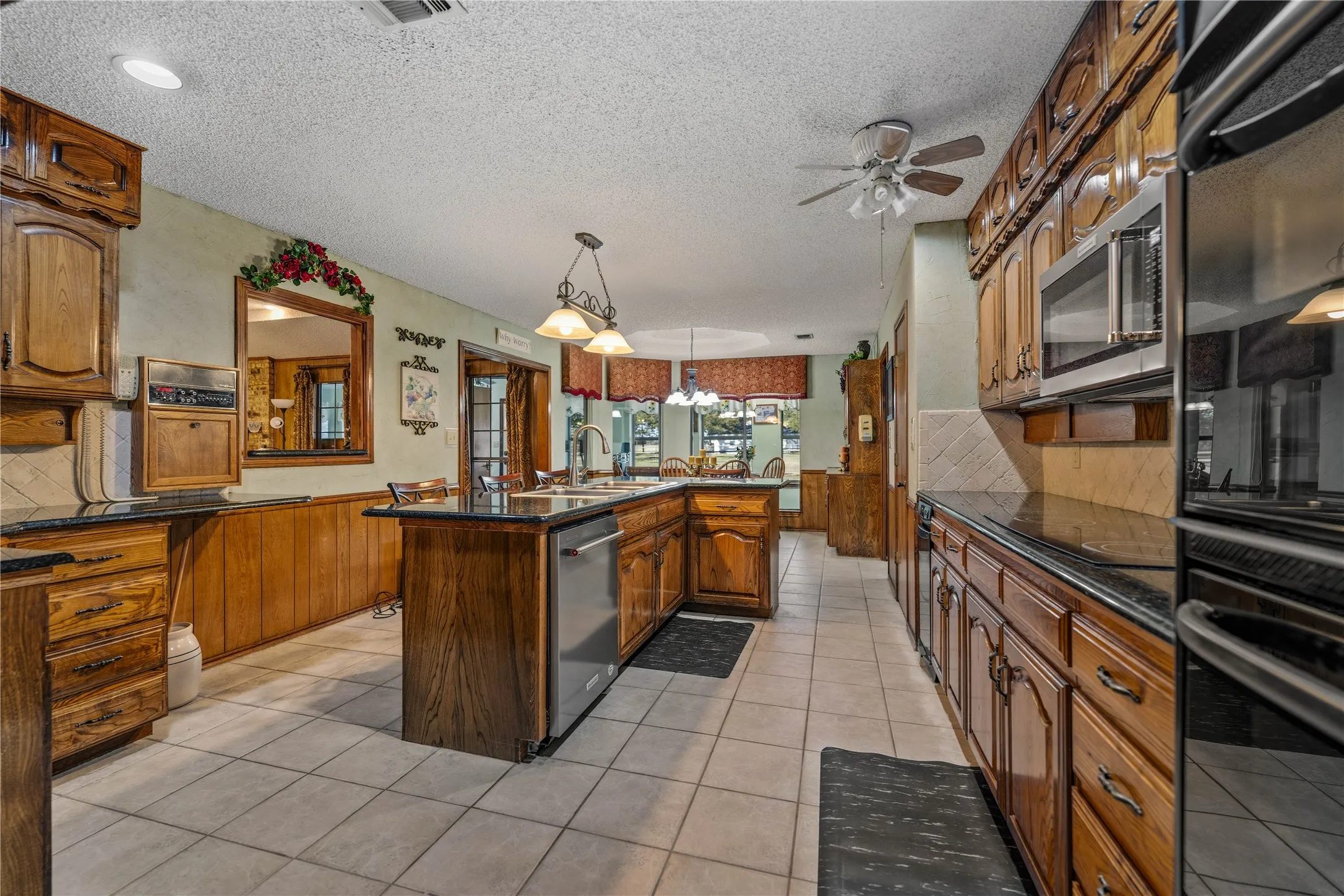 Functional kitchen with island and generous counter space.