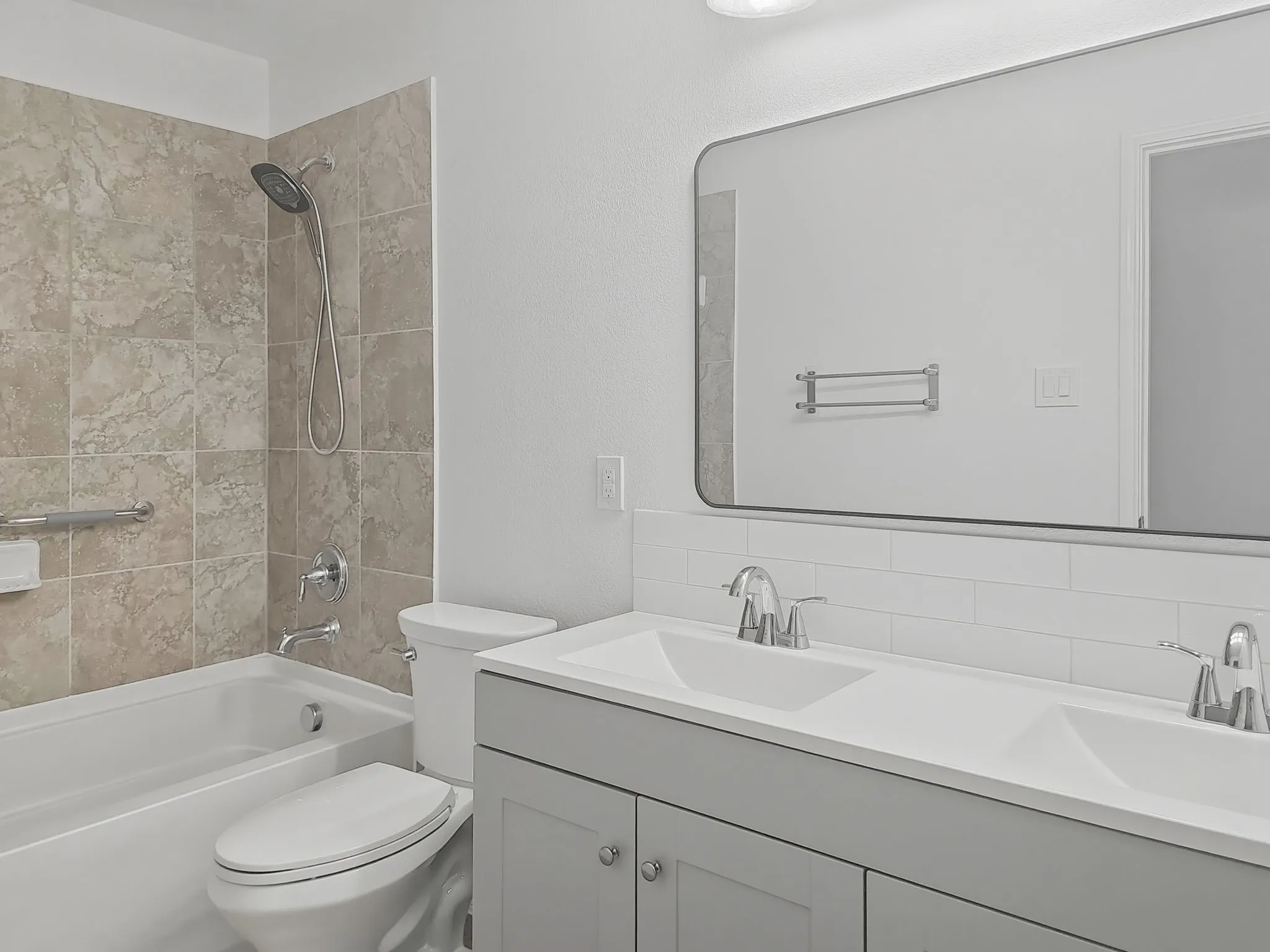 Hall bathroom with double sinks