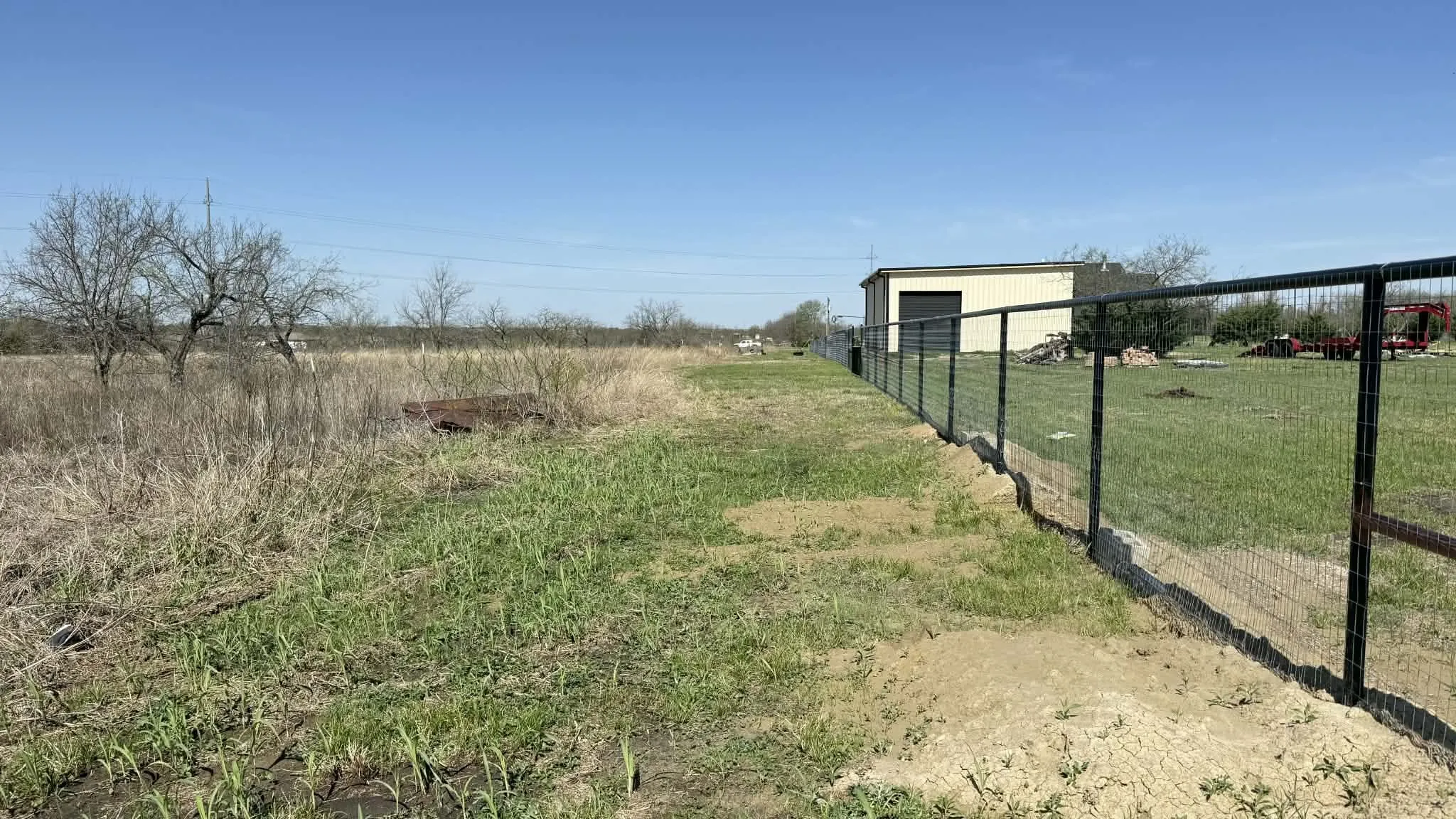 View of yard with a view of rural / pastoral area, an outbuilding, and a detached garage