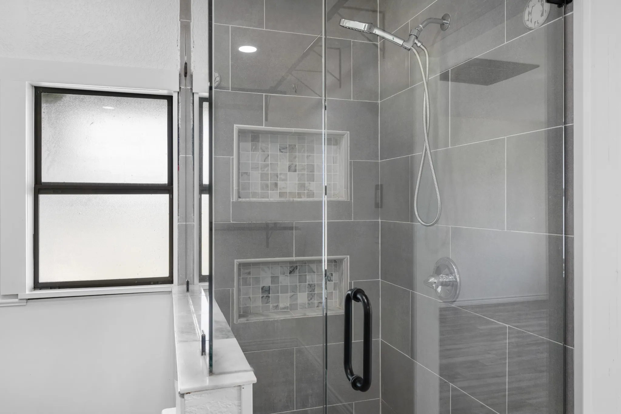 Bathroom featuring a shower stall