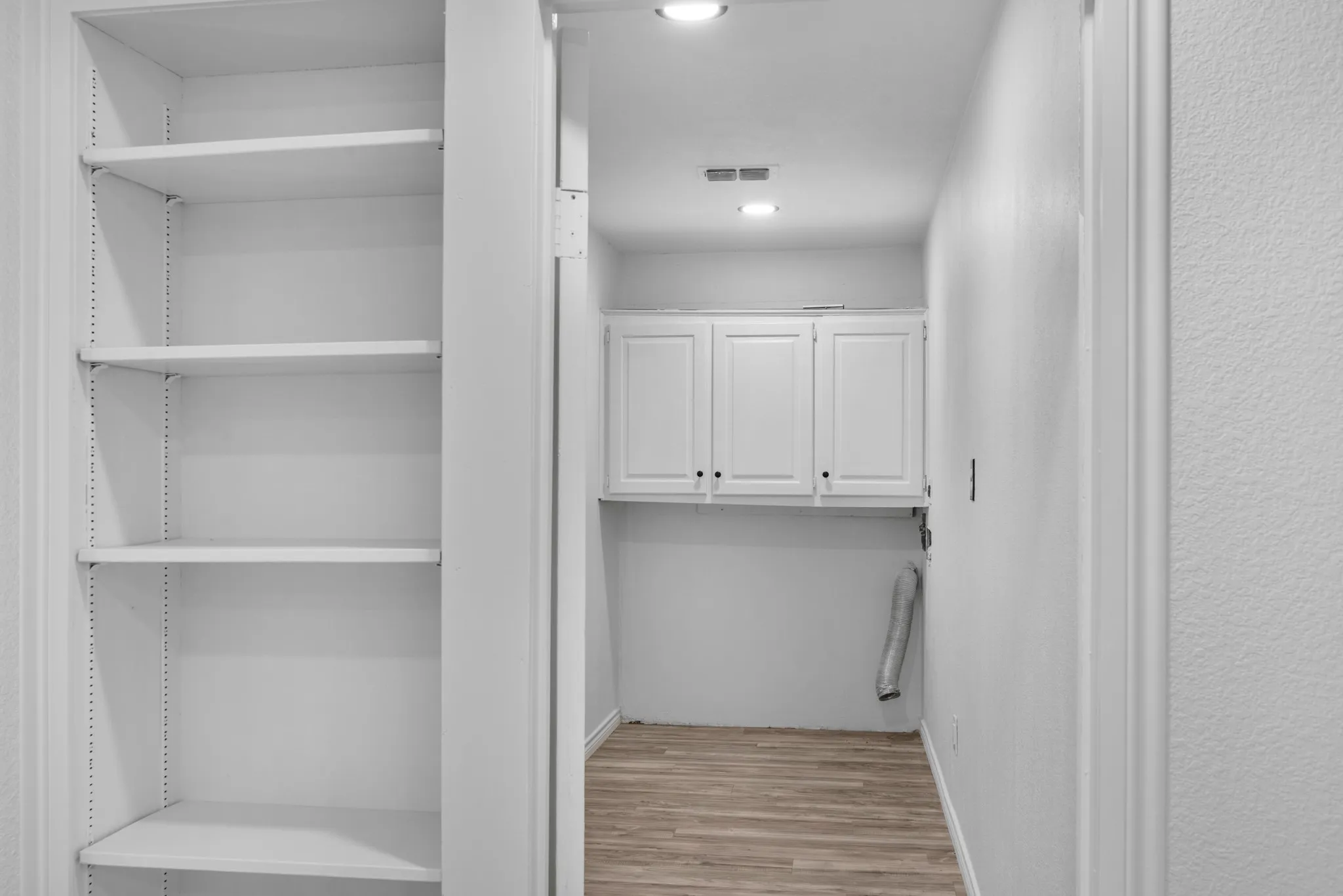 Walk in closet featuring light wood-type flooring