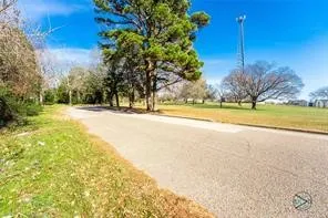 View of asphalt street   property on left
