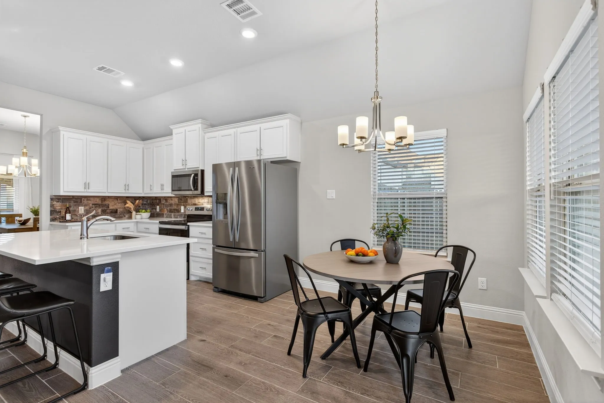 Breakfast area plus plenty of seating at the kitchen island. Room for all!