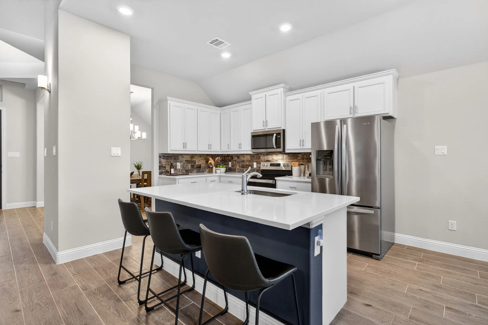 Fridge is negotiable! Love the accent color on the island.