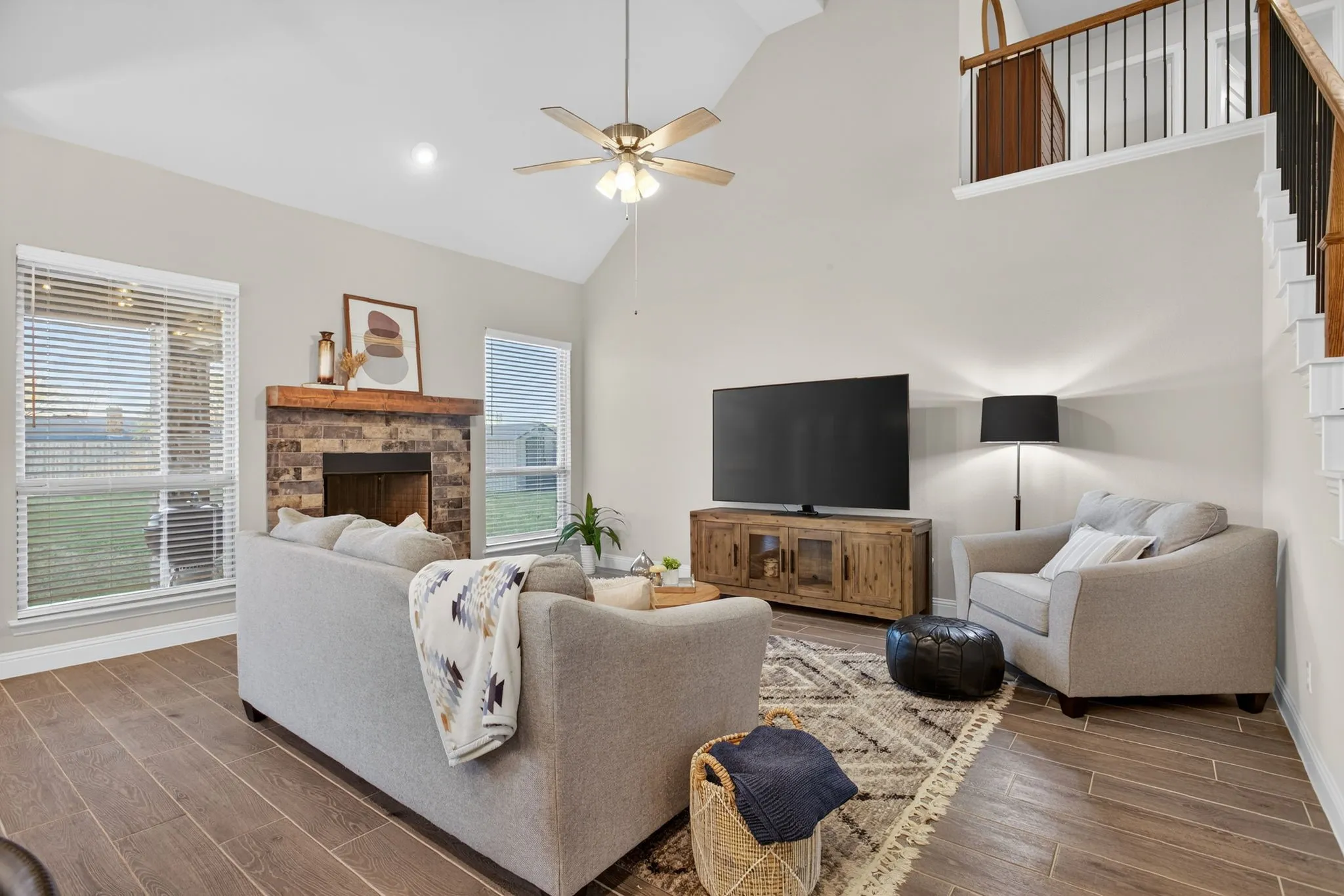 But first, the living room. Beautiful fireplace with windows flanking either side.