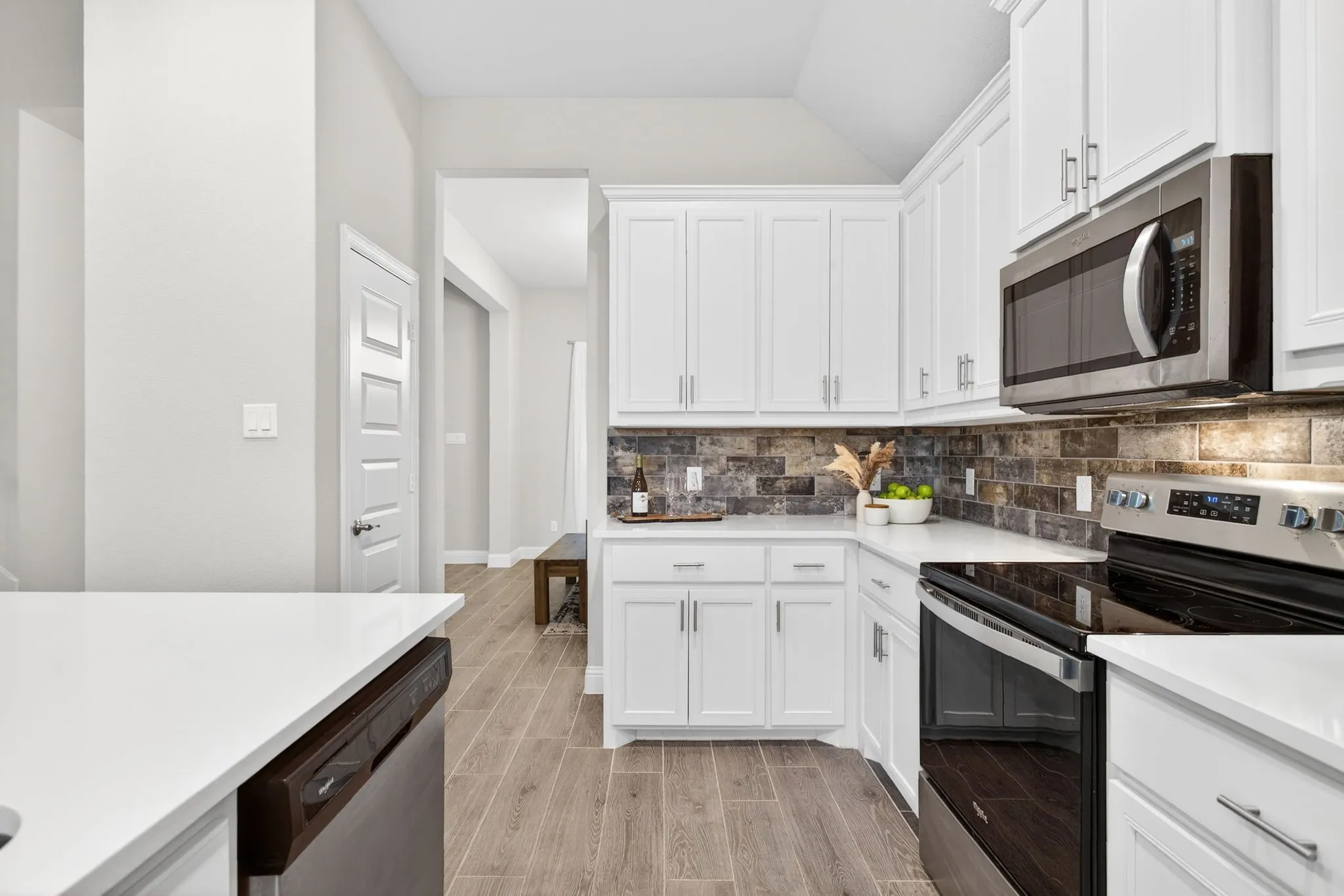 Stainless steel appliances; rich detail in the backsplash; so much storage!