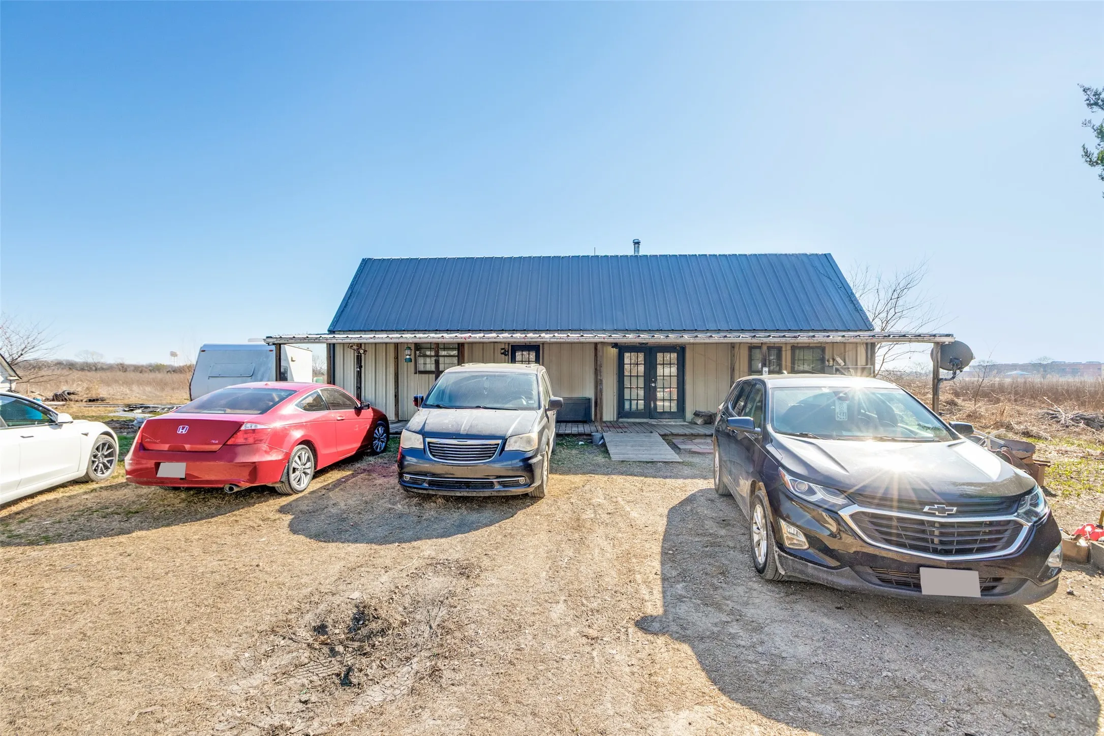 Barn structure with a metal roof and french doors