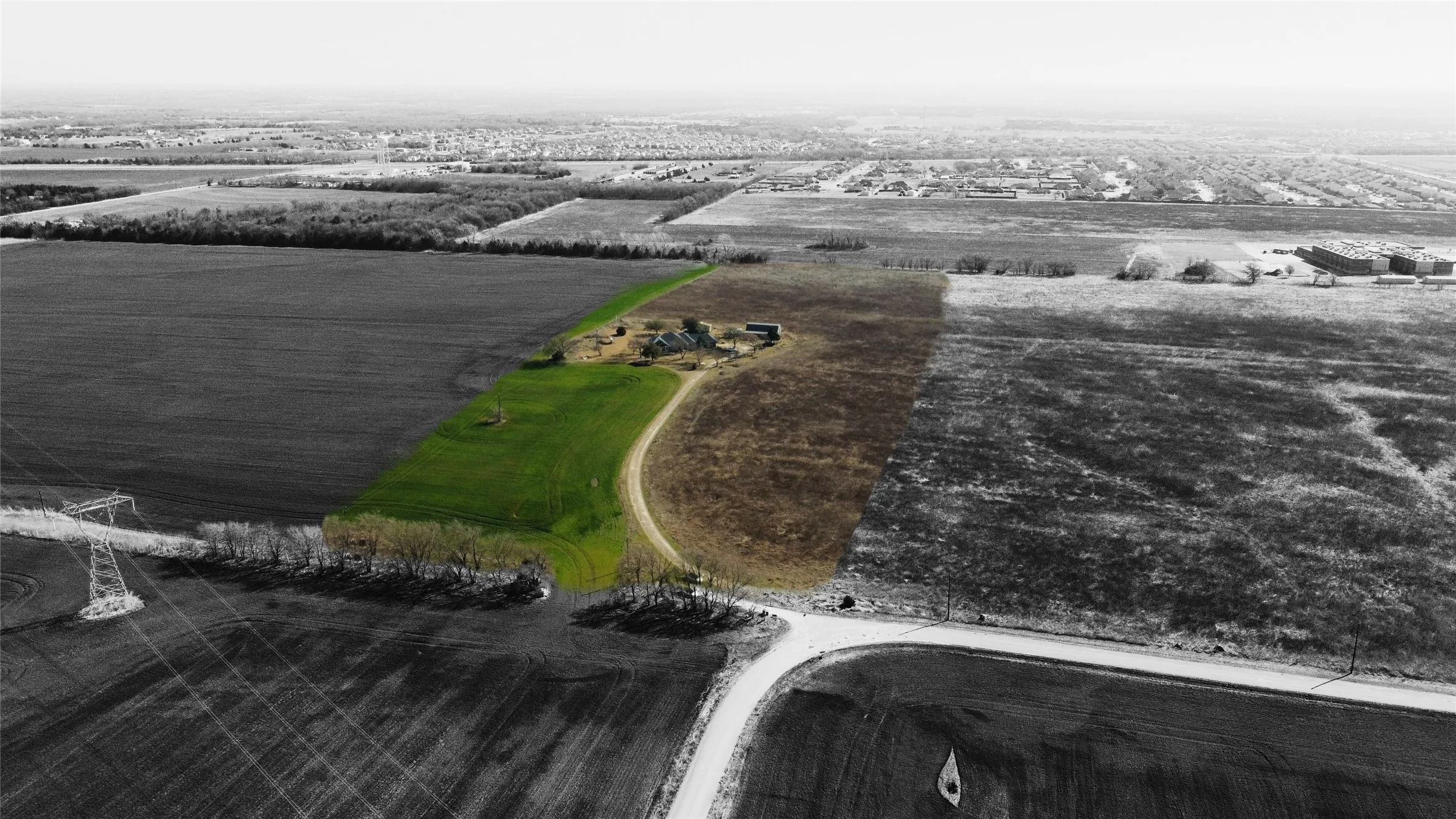 Aerial of rural area featuring large plots for crops