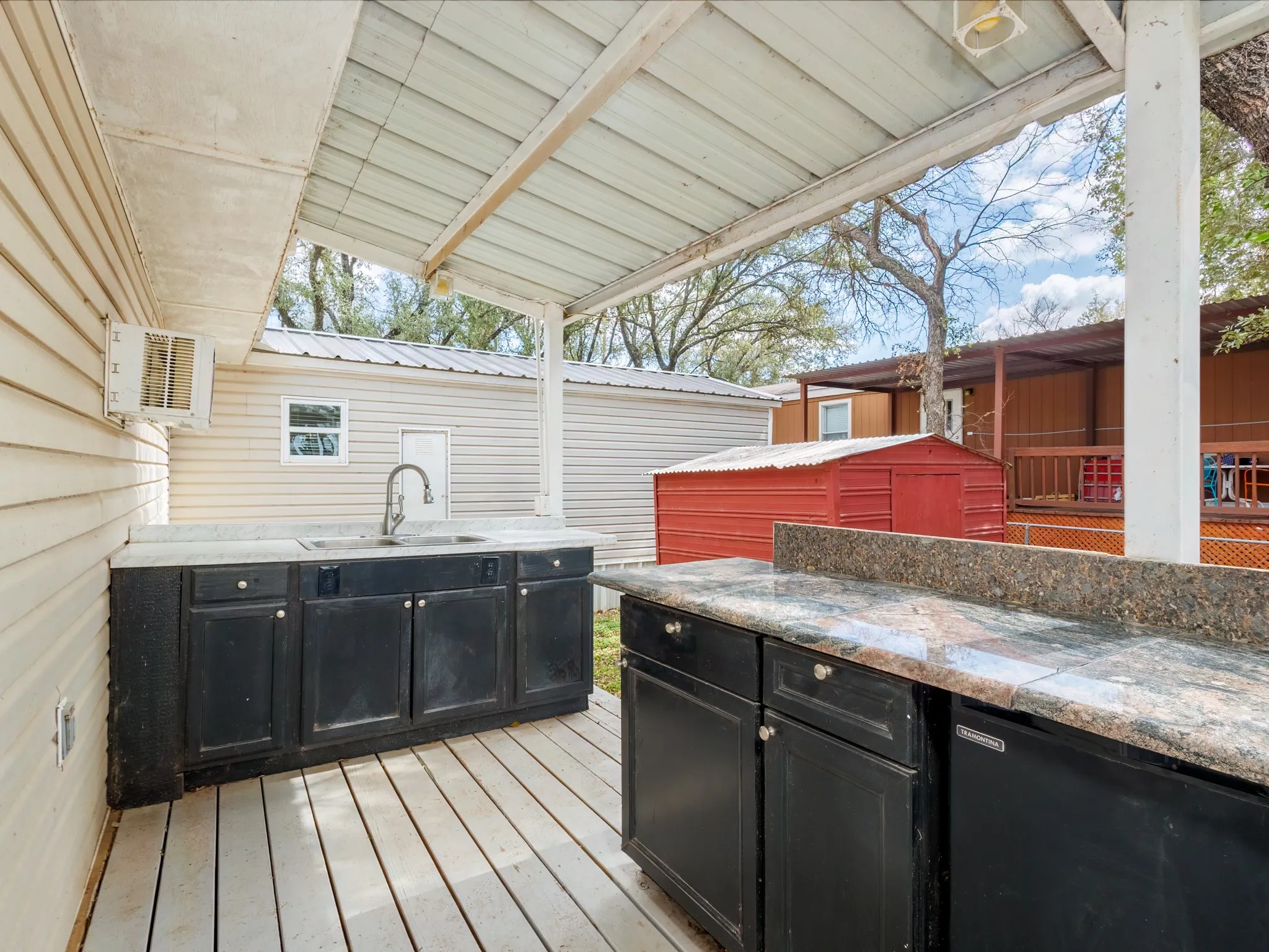 Wooden terrace with a sink