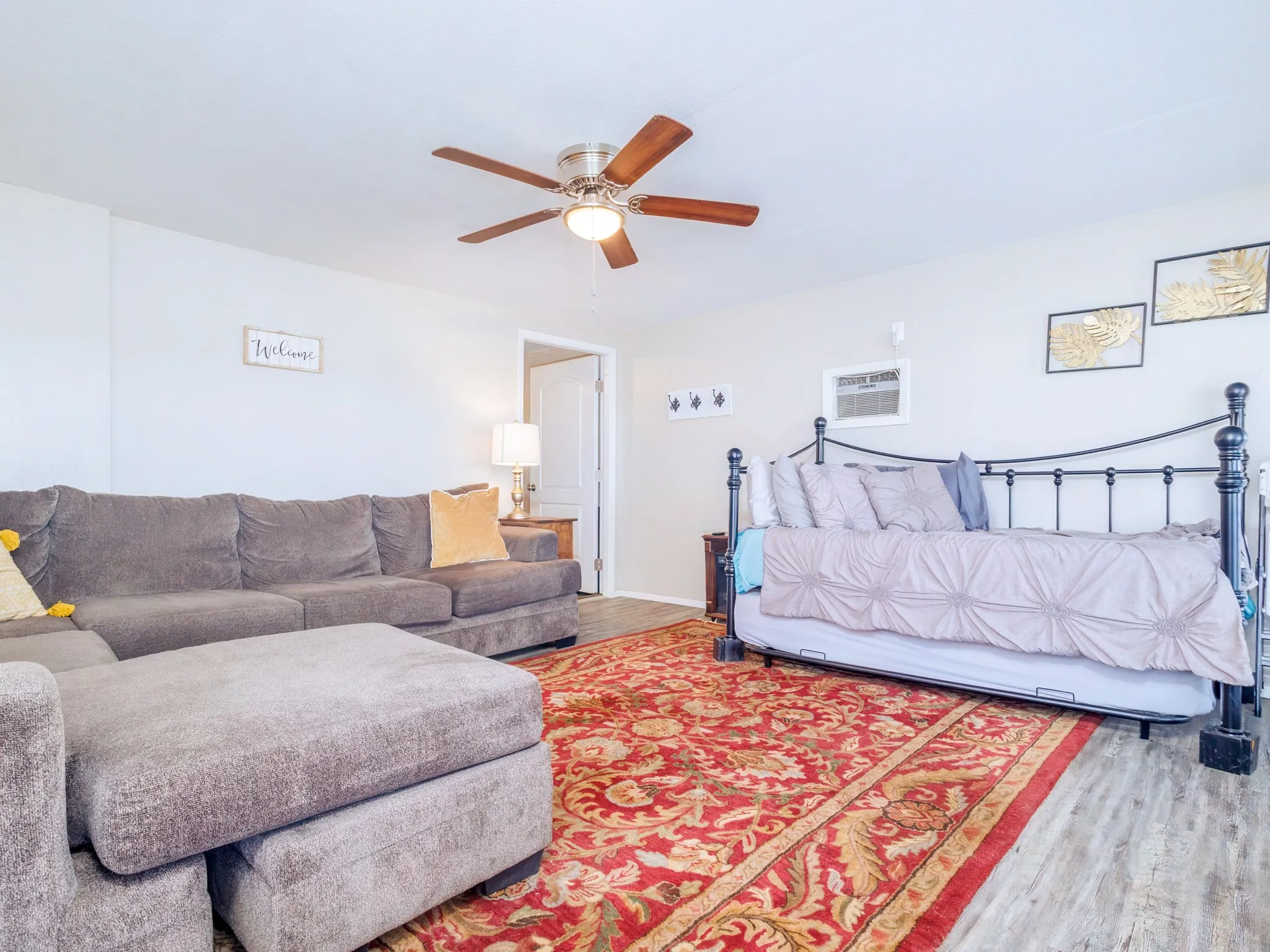 Bedroom featuring wood finished floors and ceiling fan