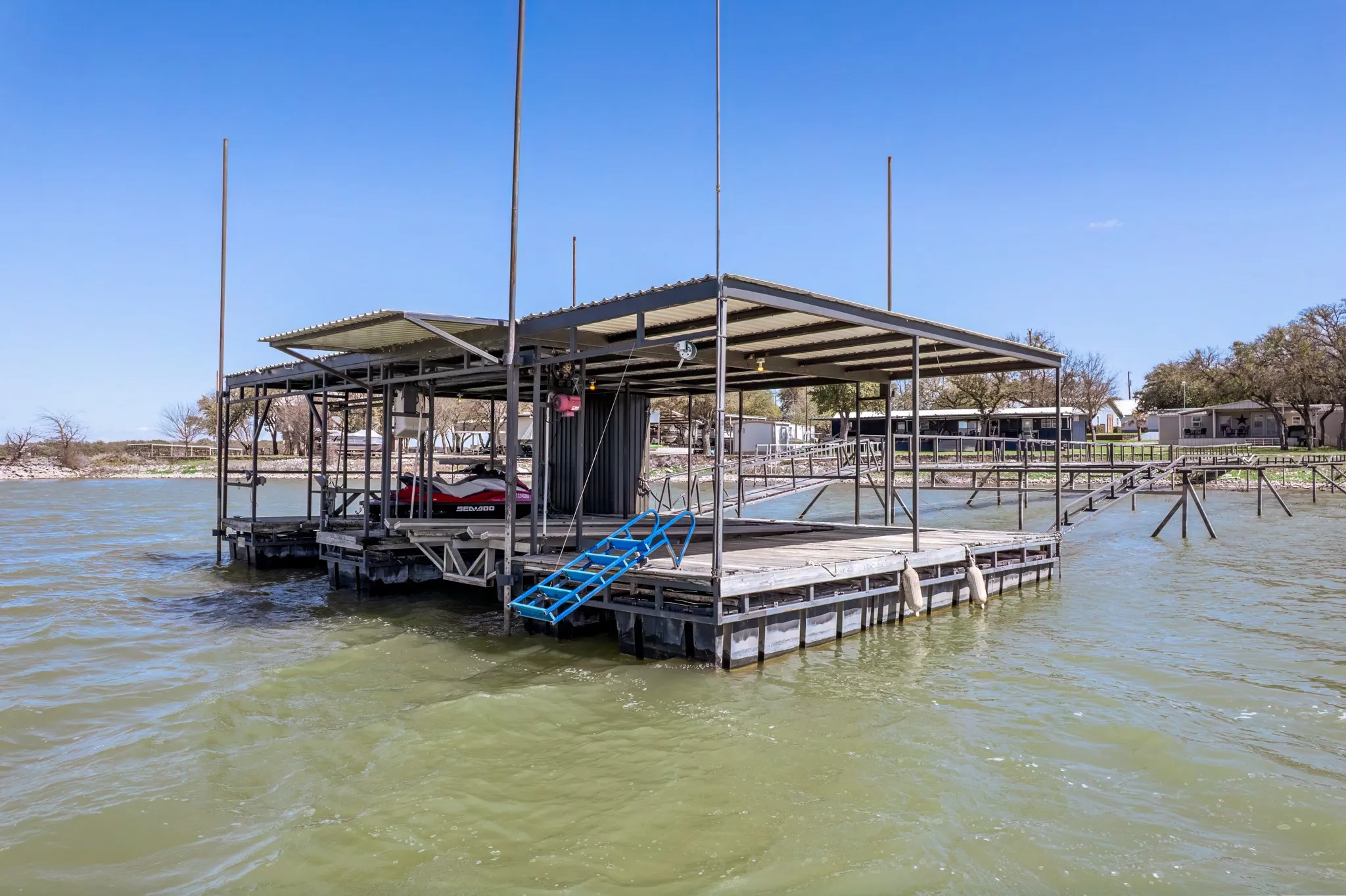 Dock with a water view and boat lift