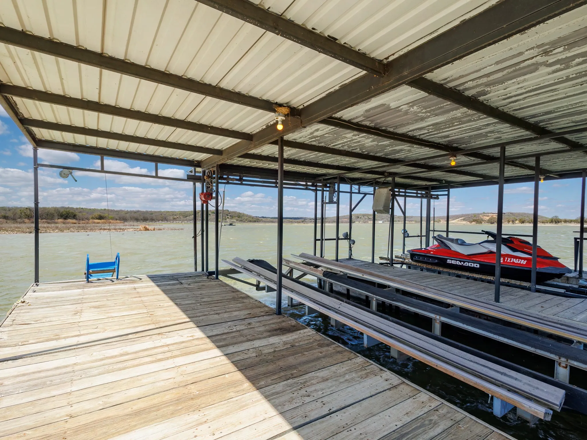 Dock area featuring boat lift