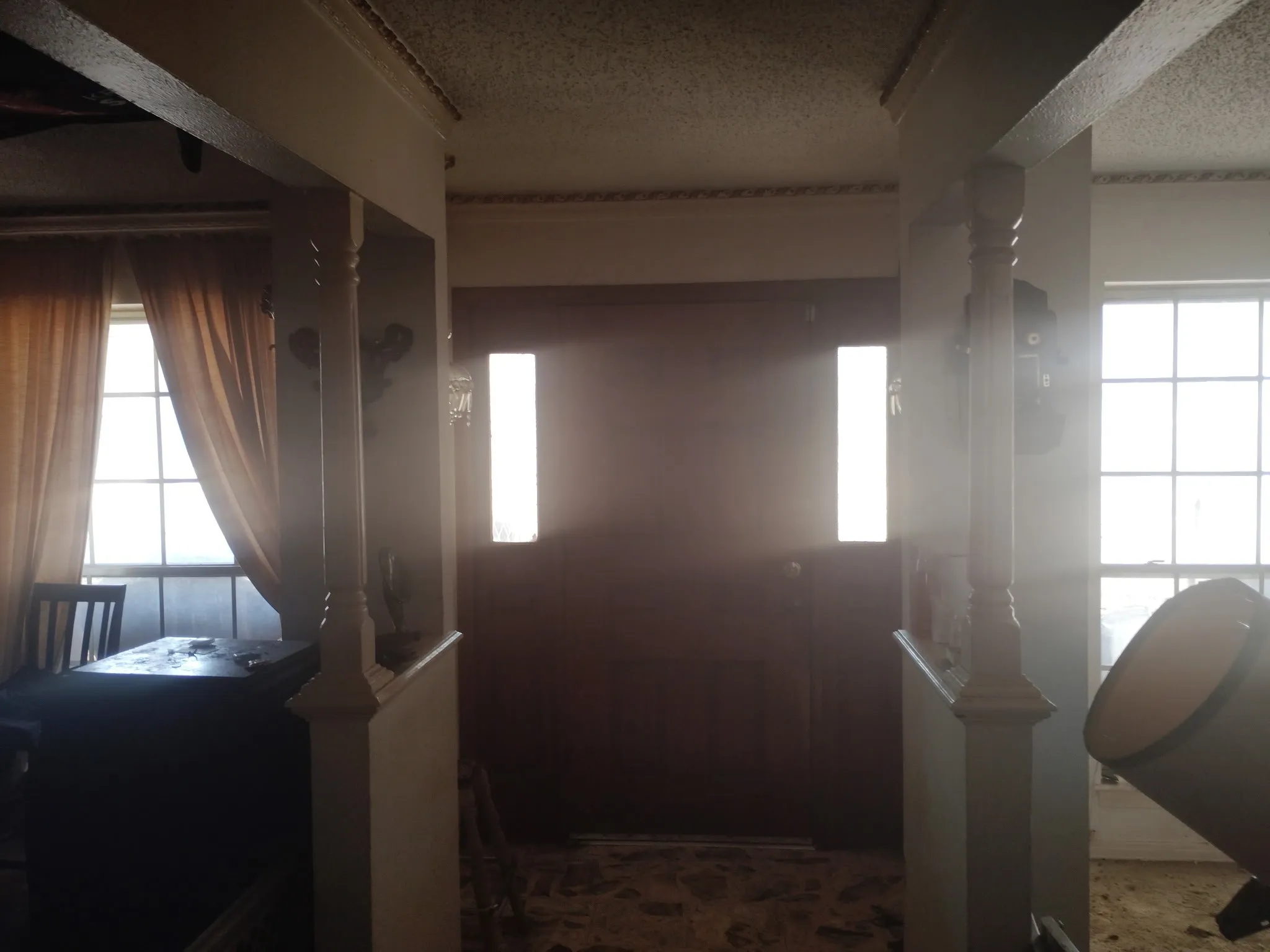 Foyer featuring a textured ceiling