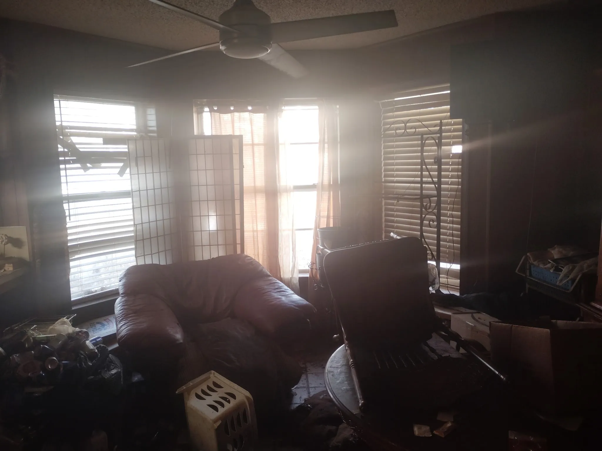 Bedroom with a textured ceiling and ceiling fan