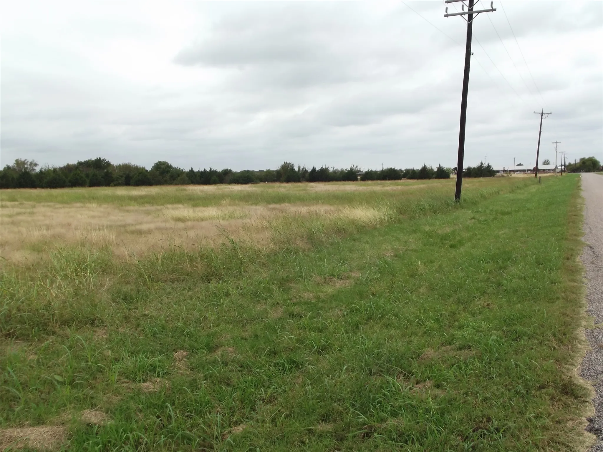 View looking west along Buck Creek Road towards Ray Roberts Parkway (Hwy 377).
