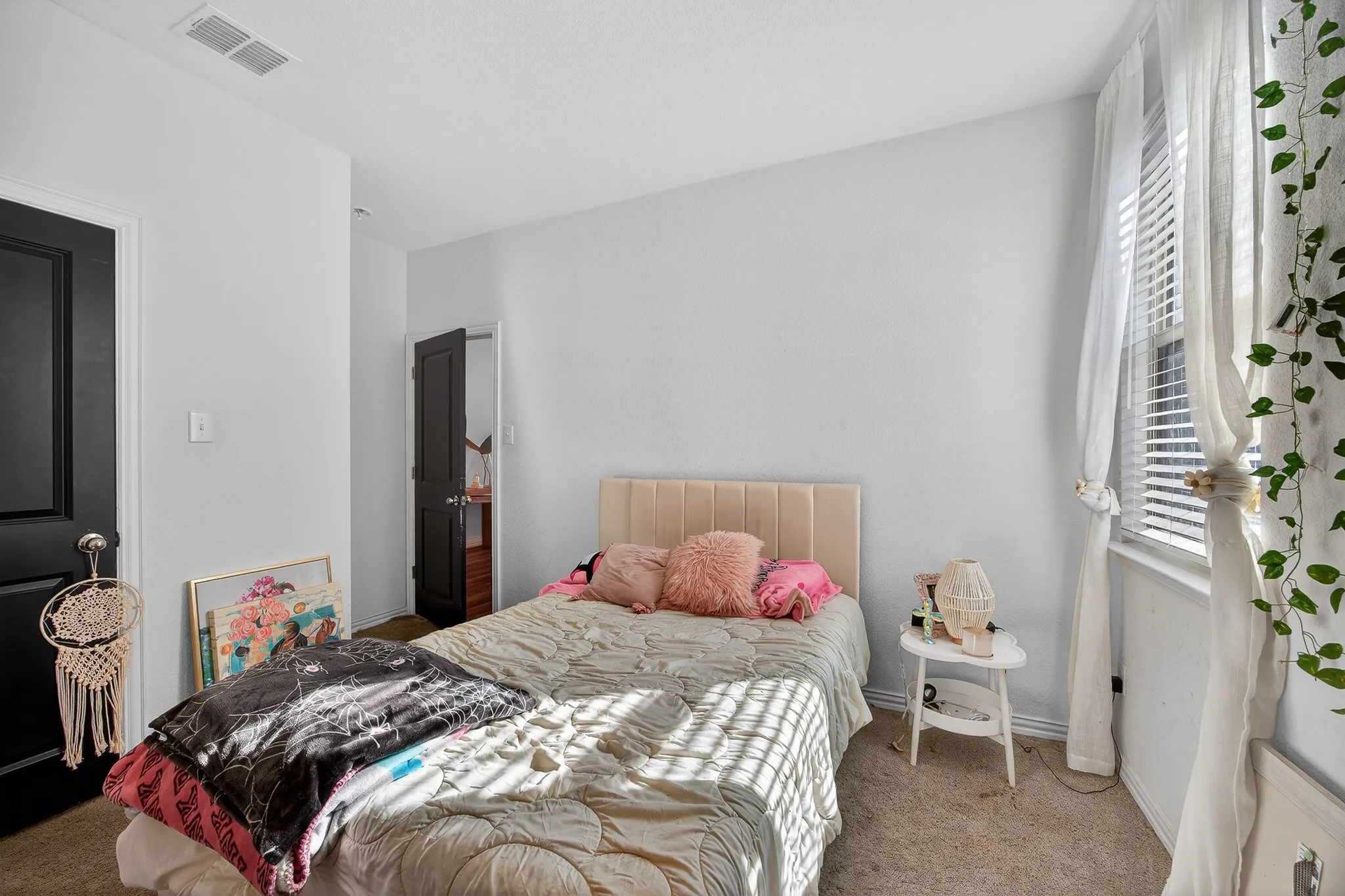 Carpeted bedroom featuring baseboards