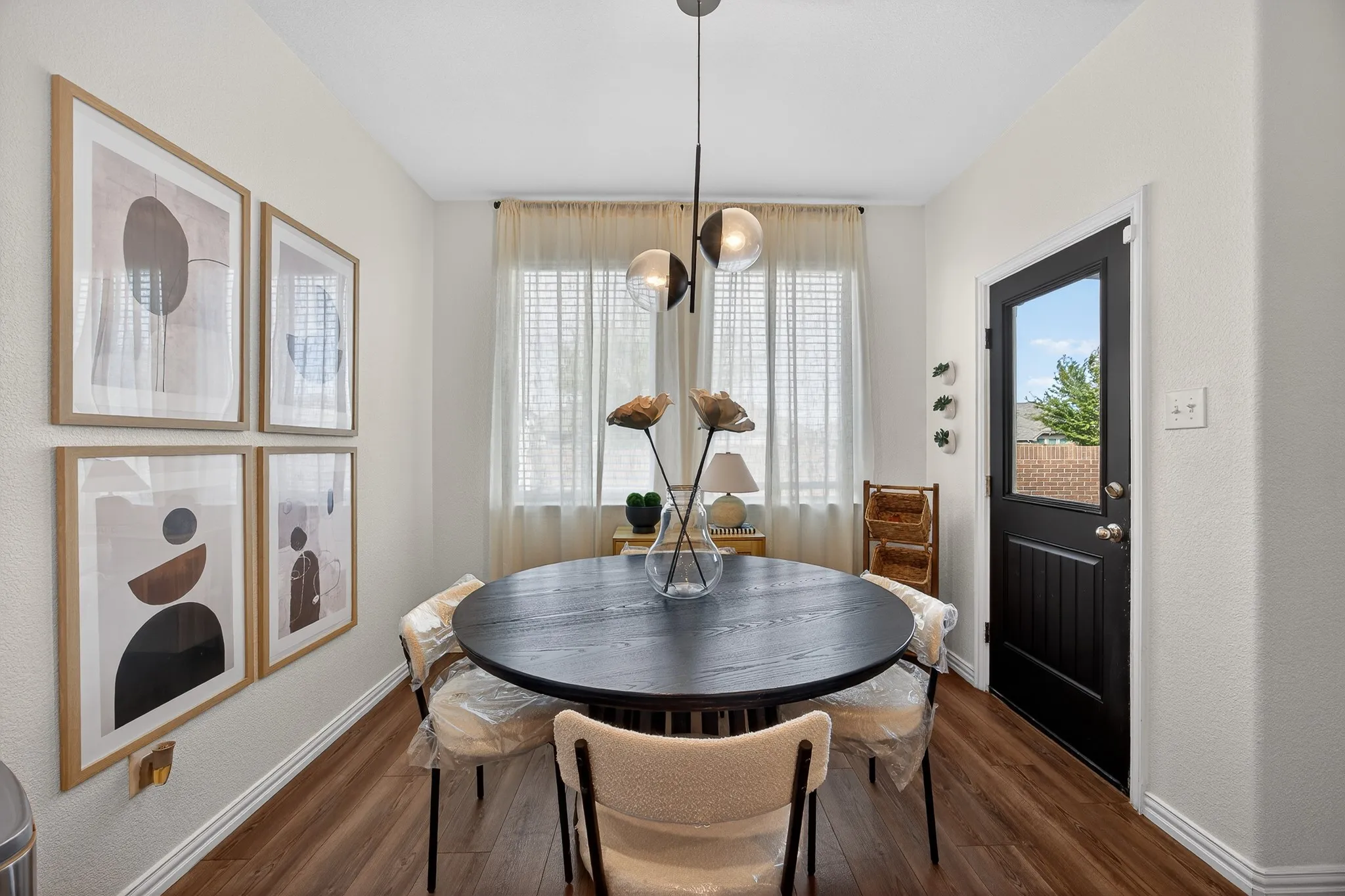 Dining room featuring baseboards and dark wood-style flooring