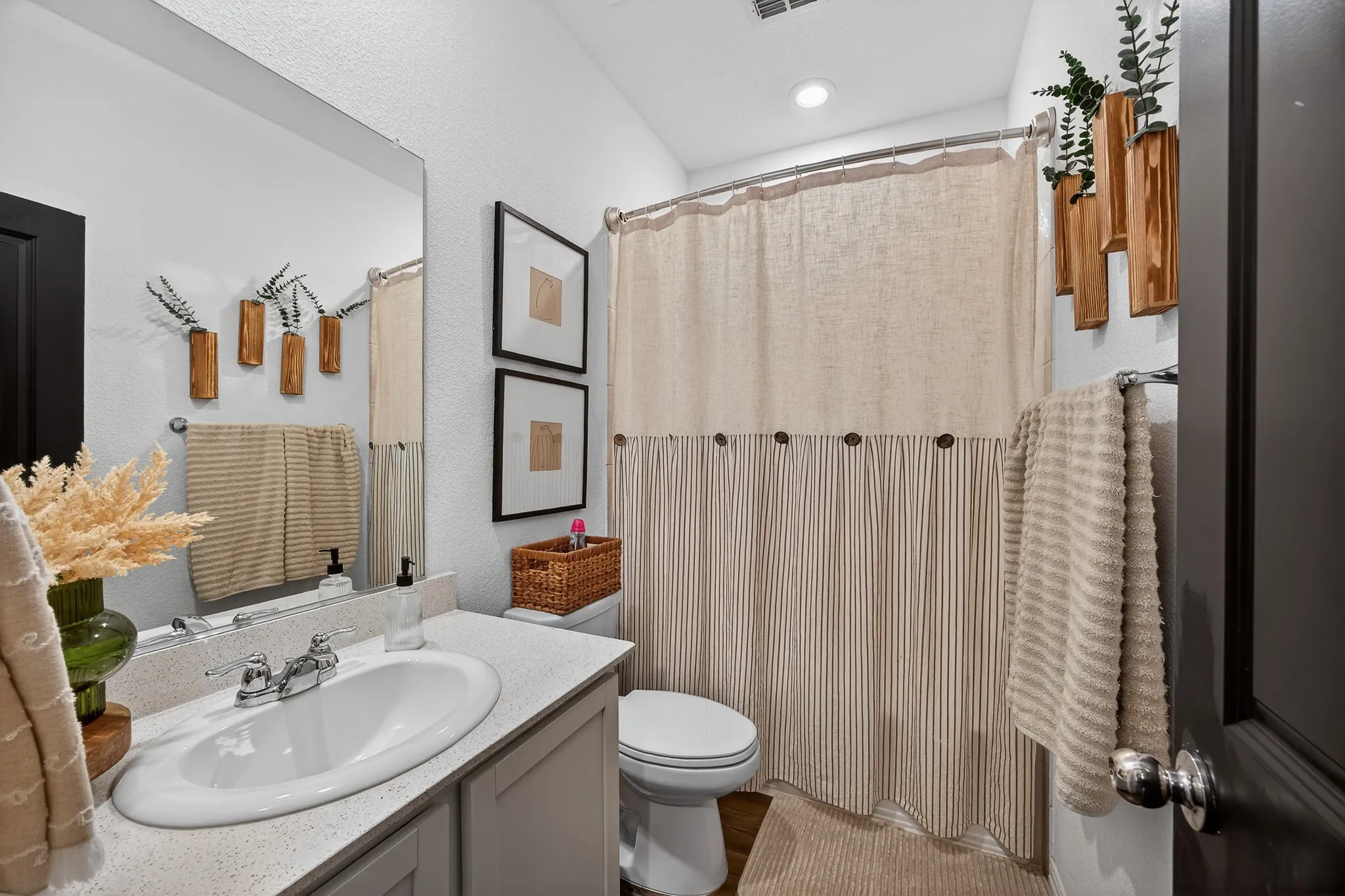 Full bathroom featuring vanity and curtained shower