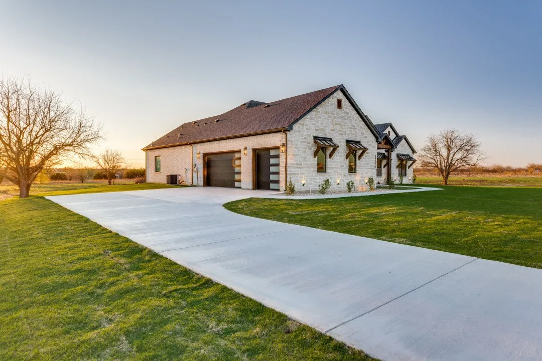 3-car garage and a long driveway
