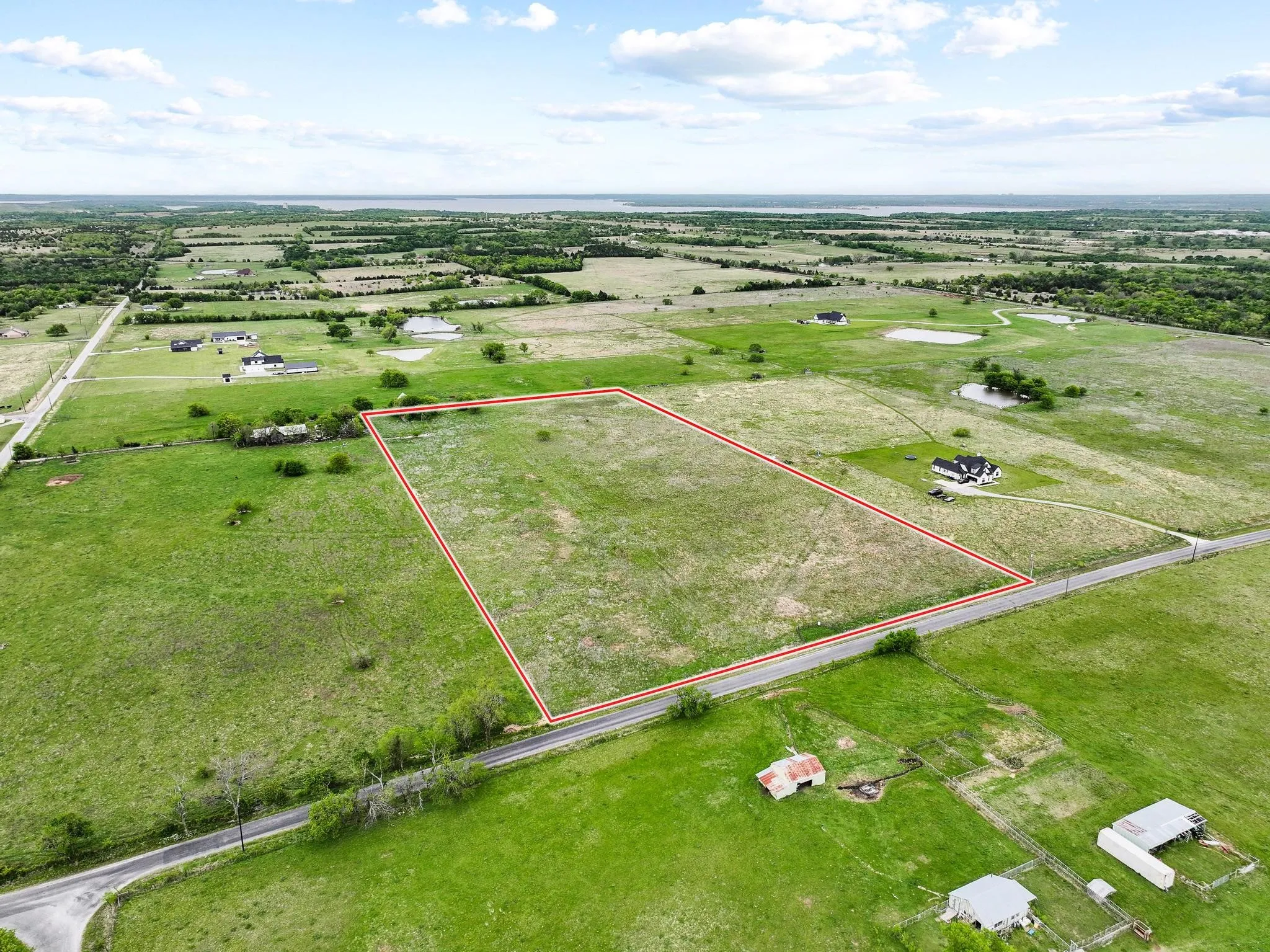 Expansive undeveloped land parcel with direct road frontage