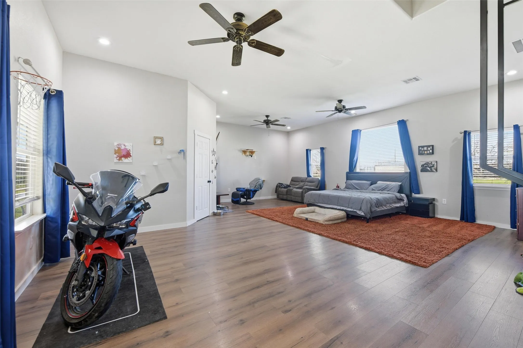 Bedroom featuring dark wood finished floors, recessed lighting, and ceiling fan
