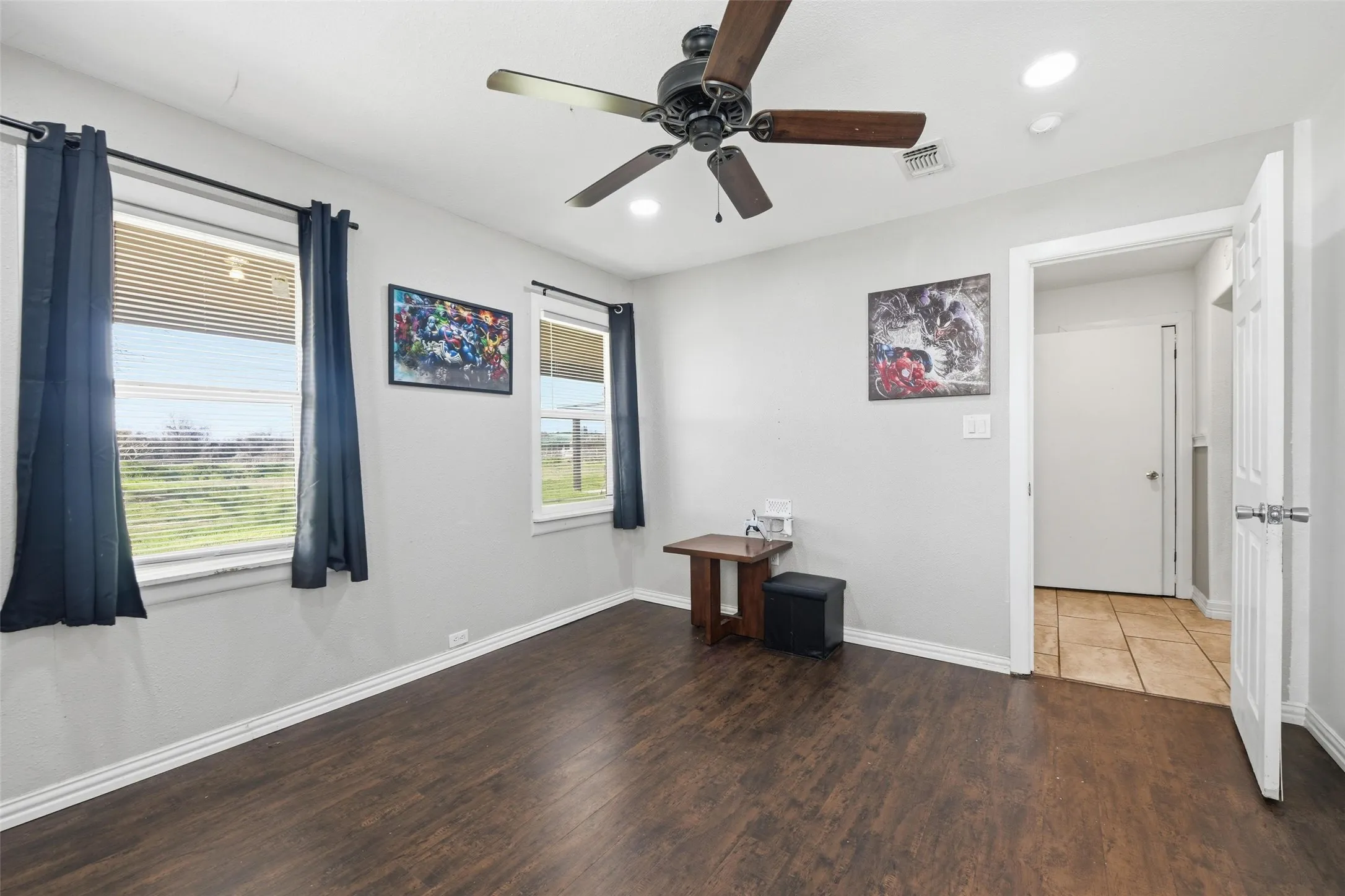 Empty room with wood finished floors, a ceiling fan, and recessed lighting