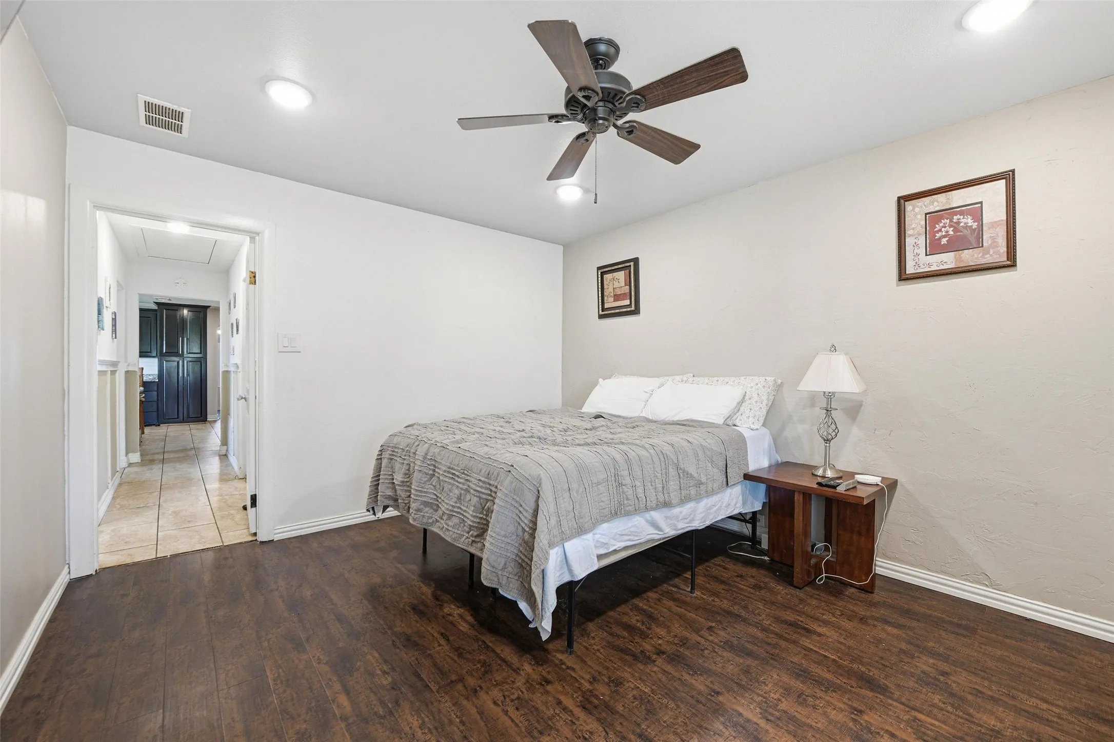 Bedroom featuring wood finished floors, ceiling fan, and recessed lighting