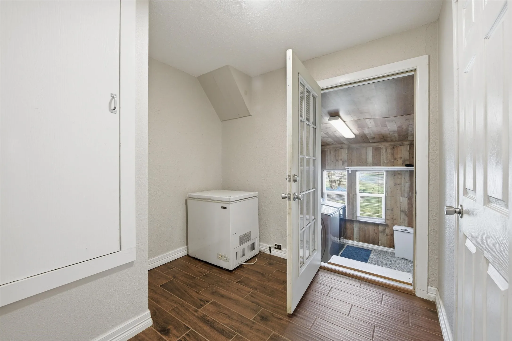 Bathroom with baseboards and wood tiled floors